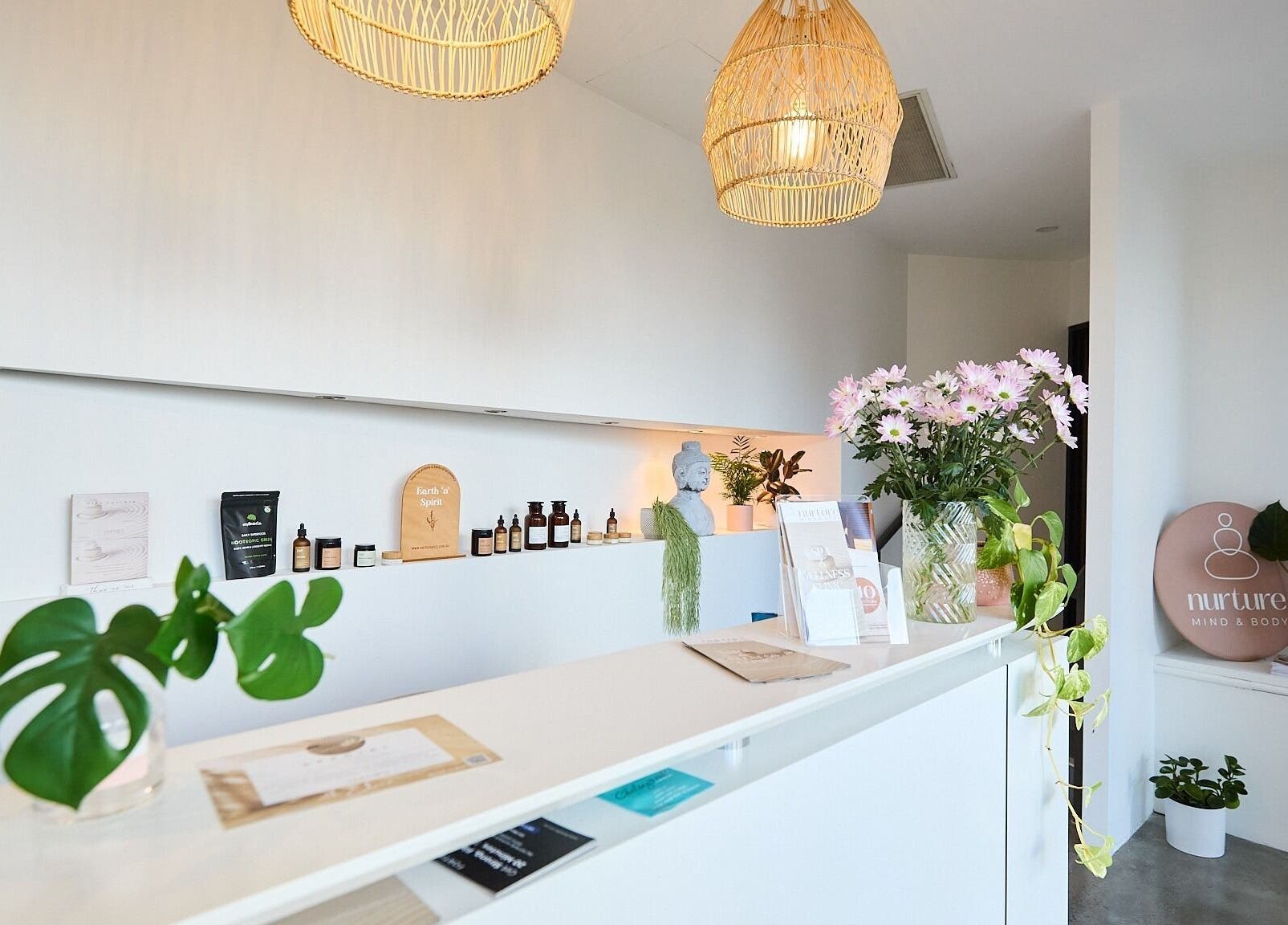 Reception area of Elena Massage & Bodywork in Paddington, New South Wales, AU. Calm, inviting decor with plants.