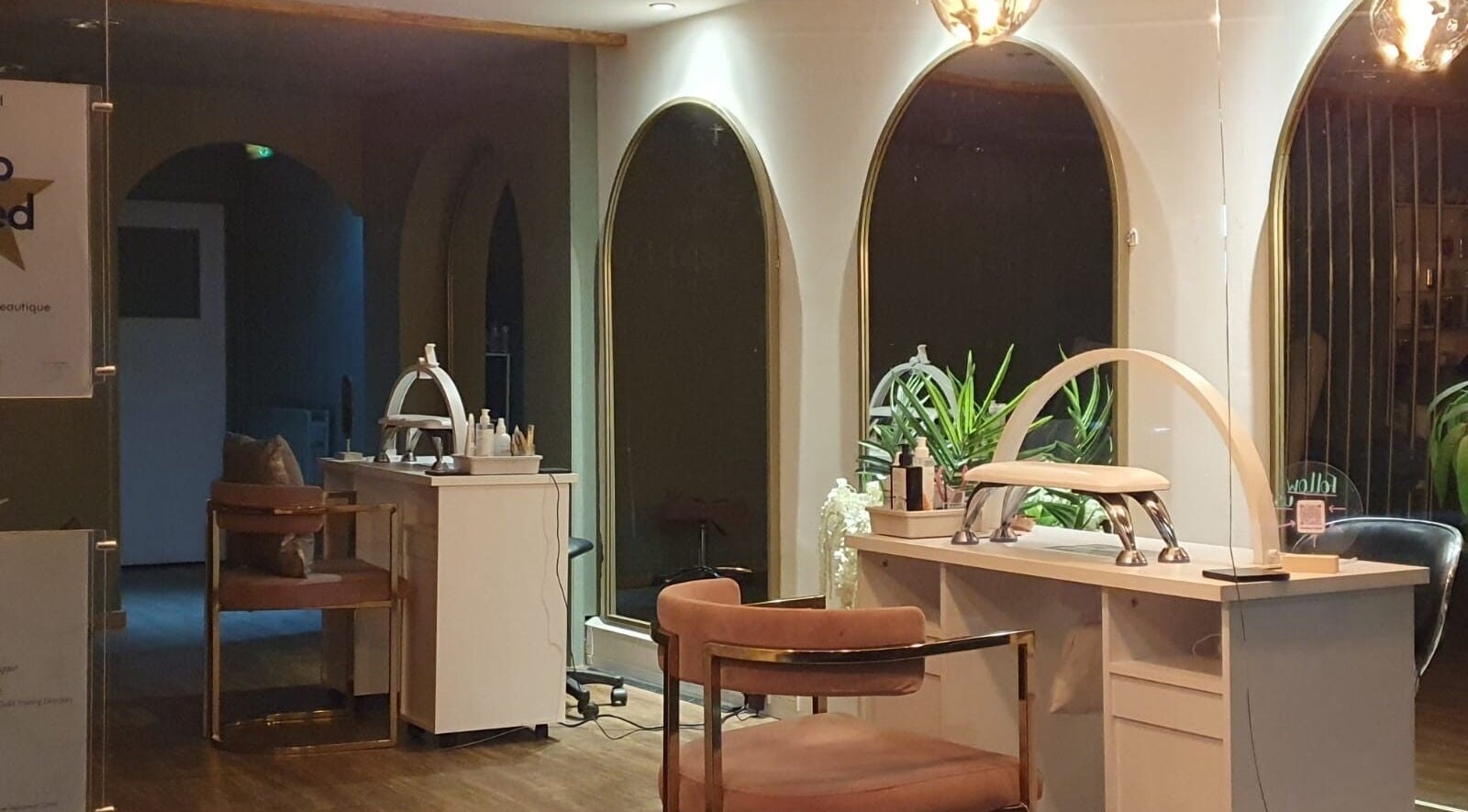 Stylish interior of Prestige Beauty Beautique in Stockport, England, GB showcasing elegant mirrors and seating.