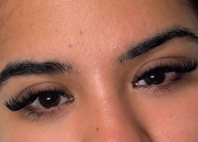 Close-up of expertly applied eyelash extensions at Lashed By Xio, London, England, GB, showcasing detailed work.