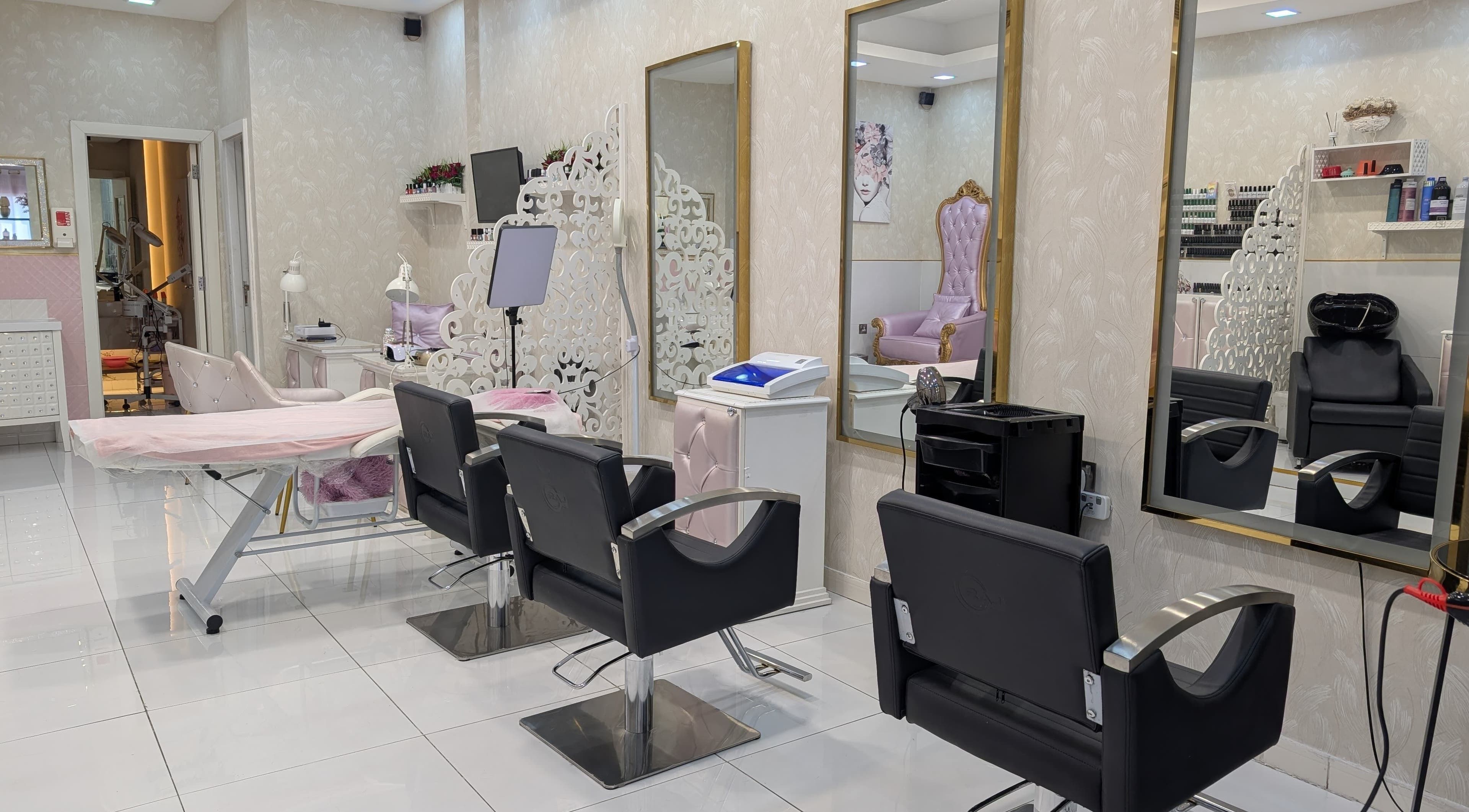 Luxurious interior of Zulya Beauty Salon in Dubai, AE showcases elegant chairs and mirrors.