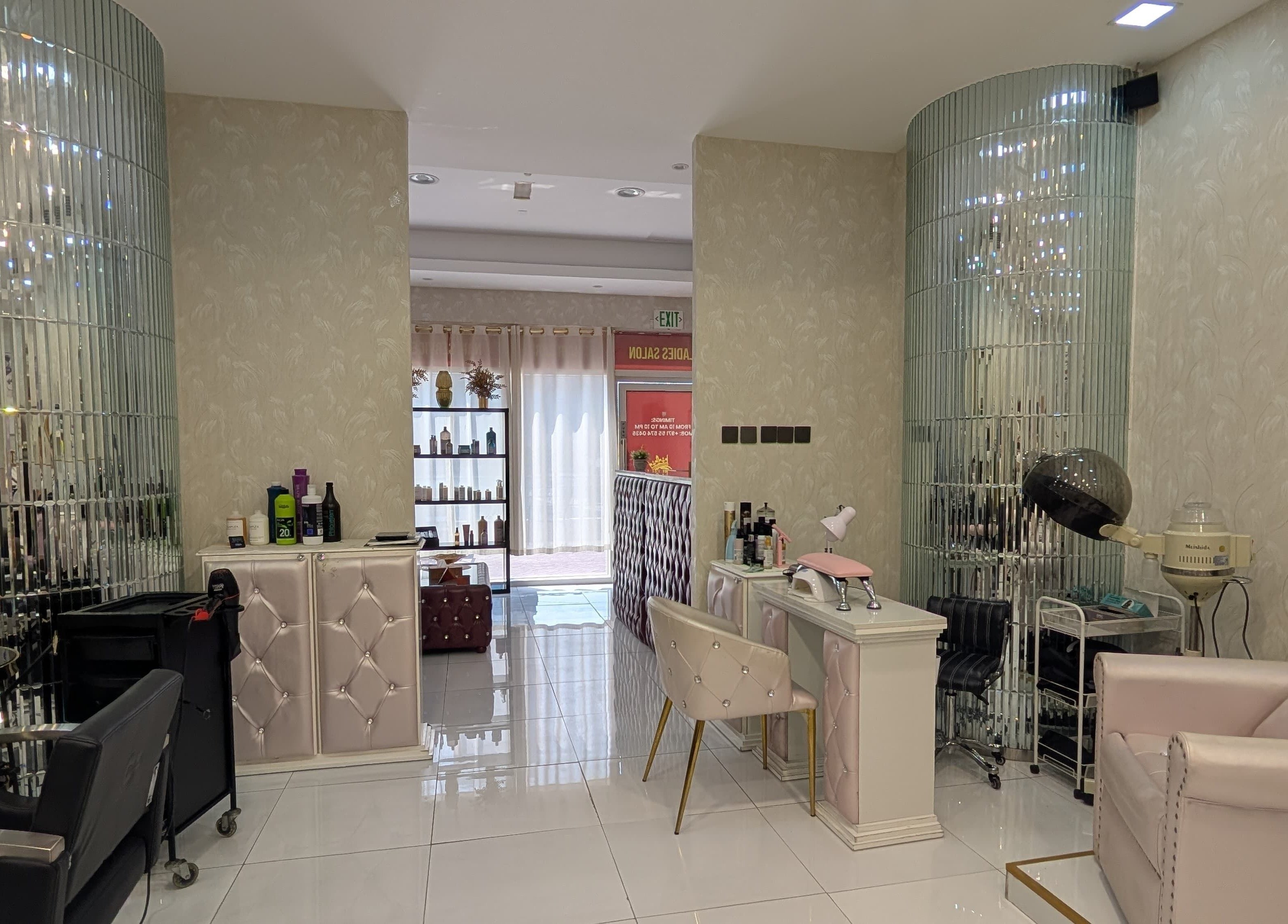 Stylish interior of Zulya Beauty Salon in Dubai, AE featuring plush seating and modern hair stations.