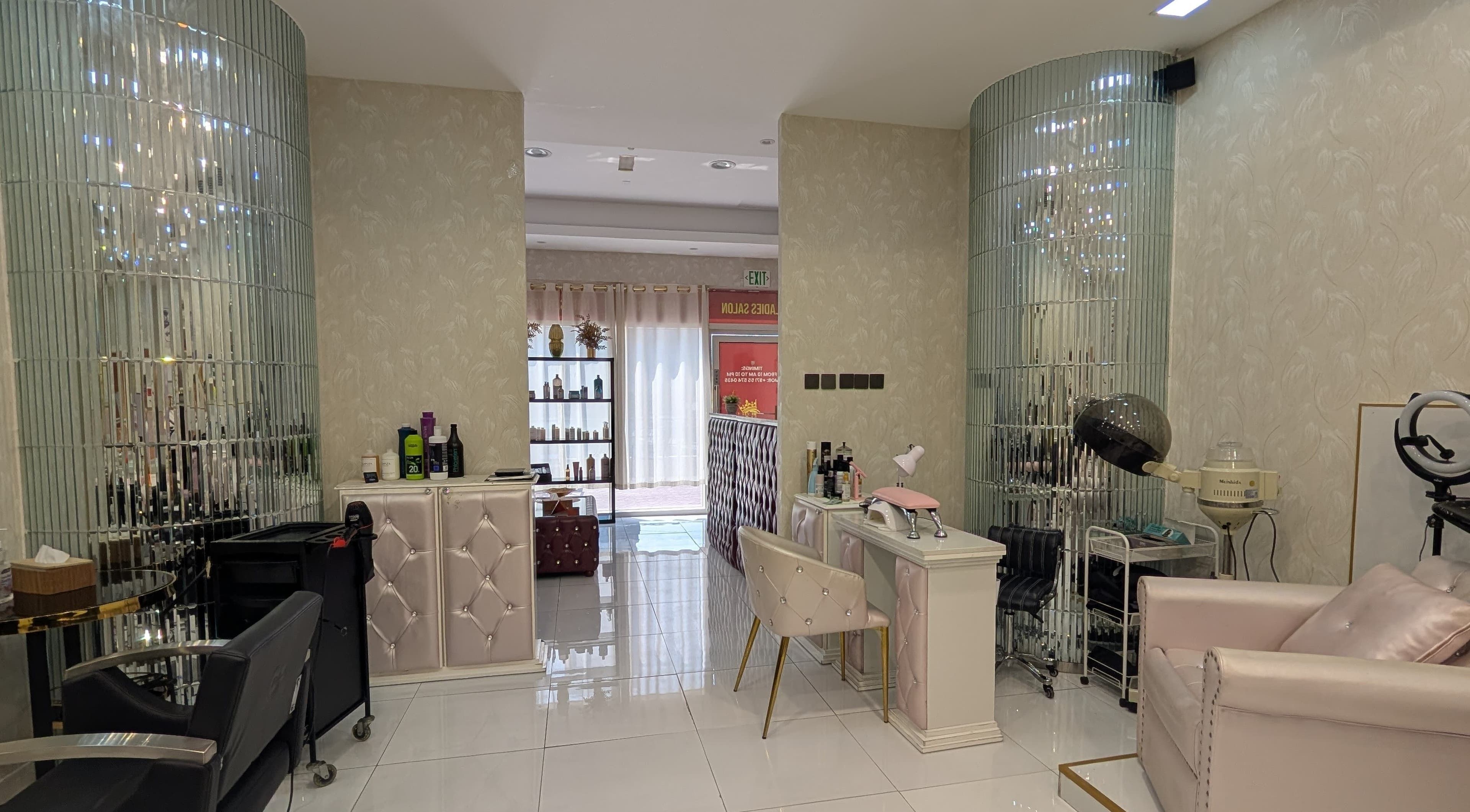 Stylish interior of Zulya Beauty Salon in Dubai, AE featuring plush seating and modern hair stations.