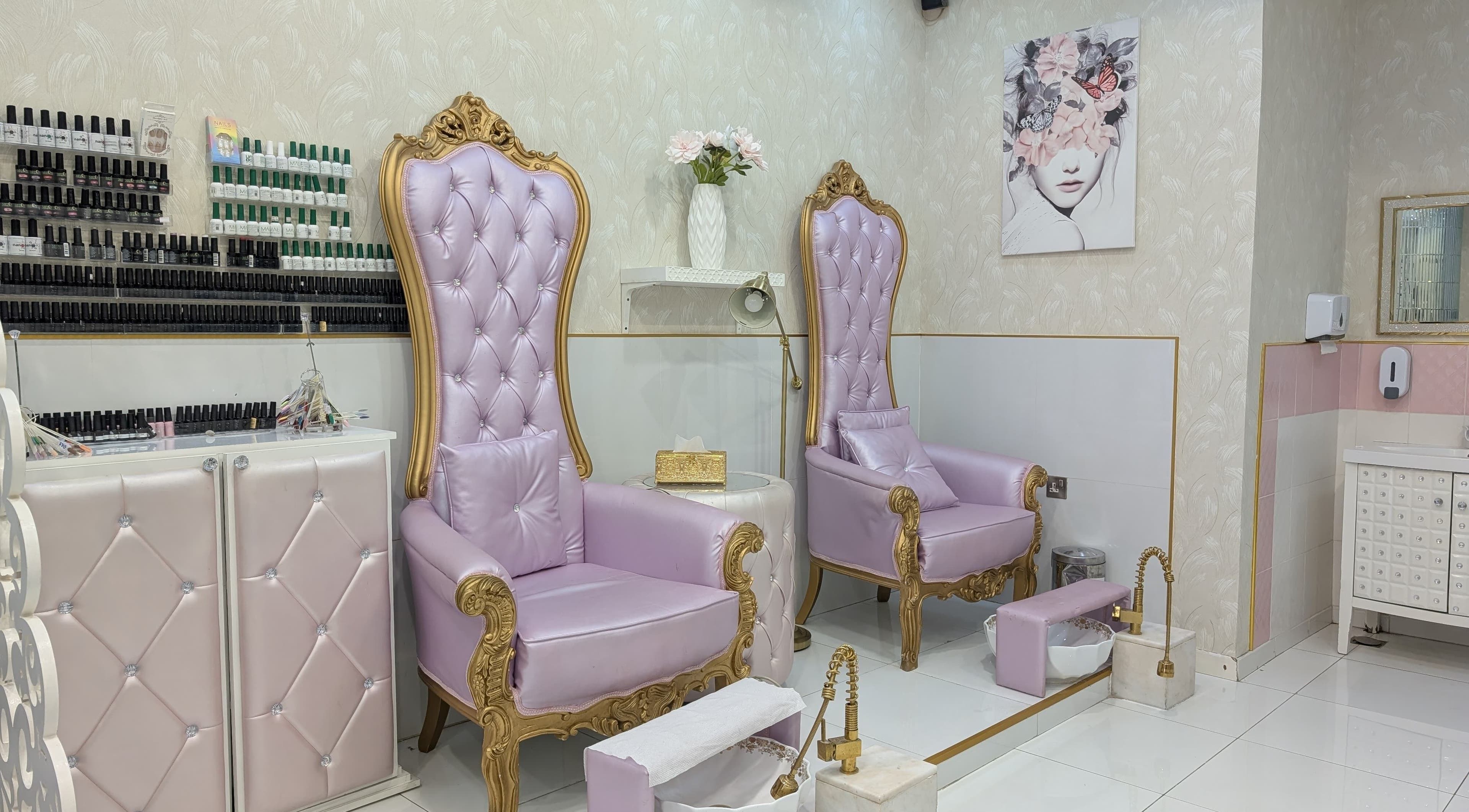 Luxurious purple chairs at Zulya Beauty Salon in Dubai, AE, showcasing elegance and comfort with gold accents.