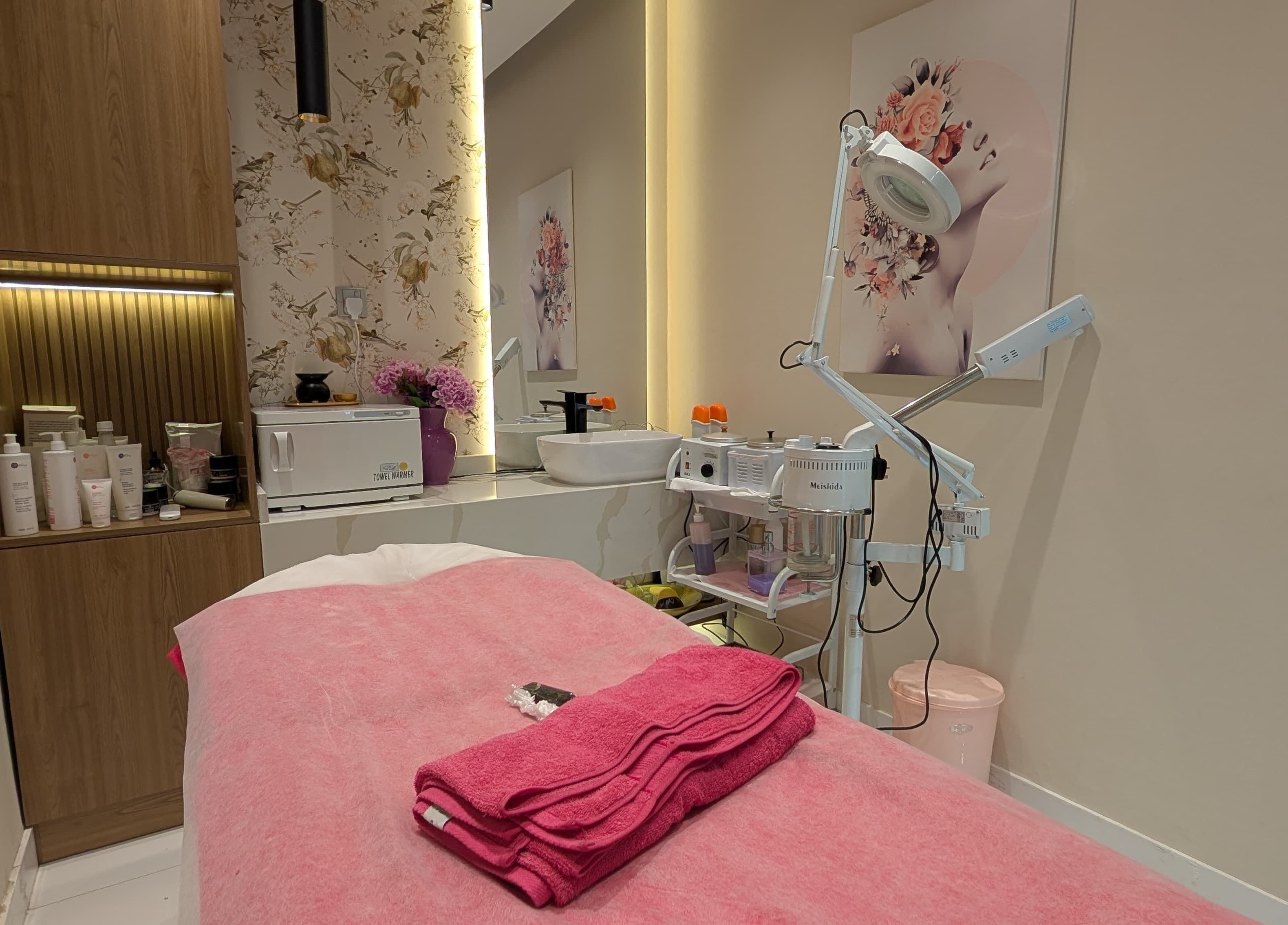Relaxing facial treatment room at Zulya Beauty Salon, Dubai, AE, featuring elegant decor and skincare equipment.