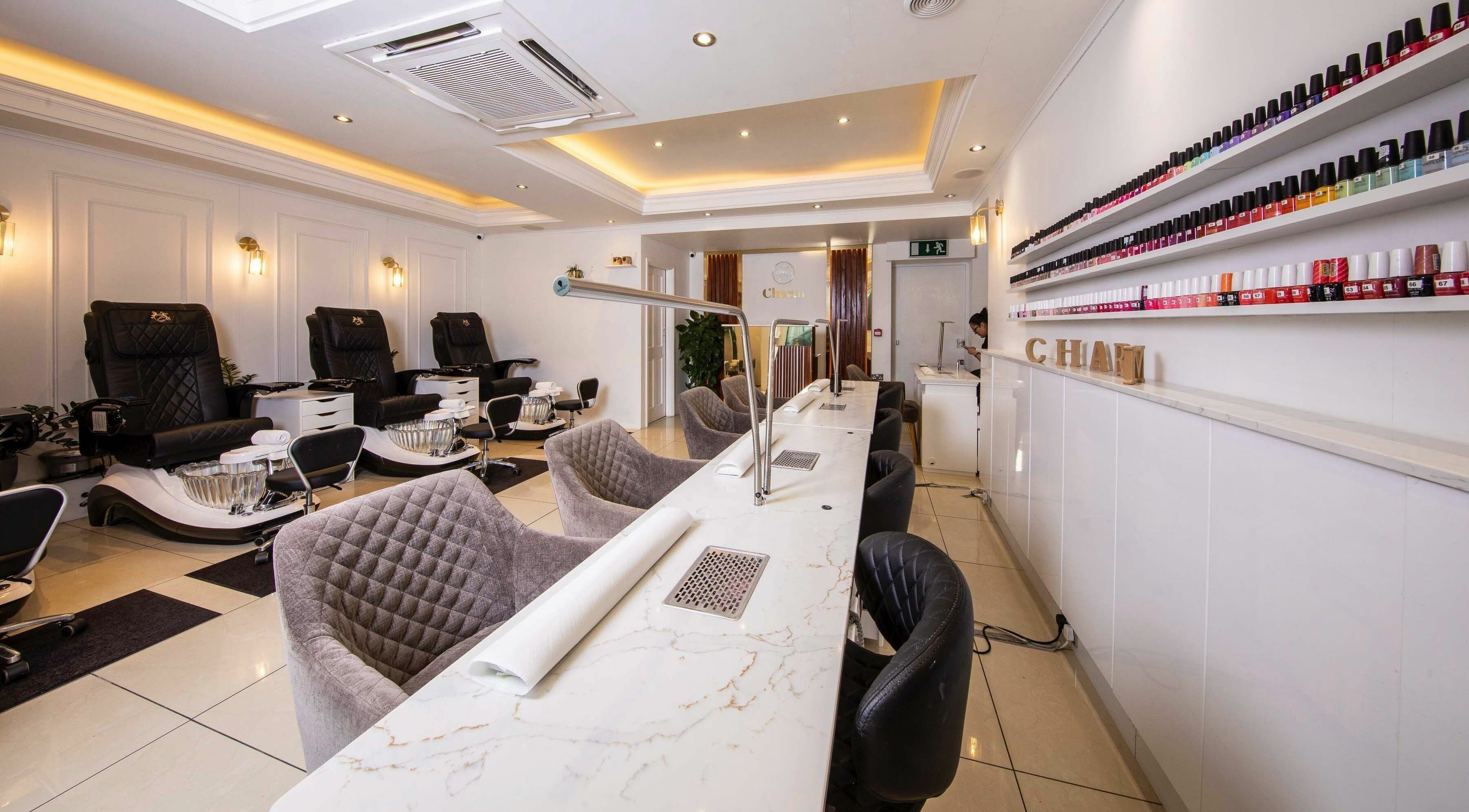 Modern nail bar at Charm Blanchardstown Village in Dublin, IE with plush seating and vibrant polish selection.