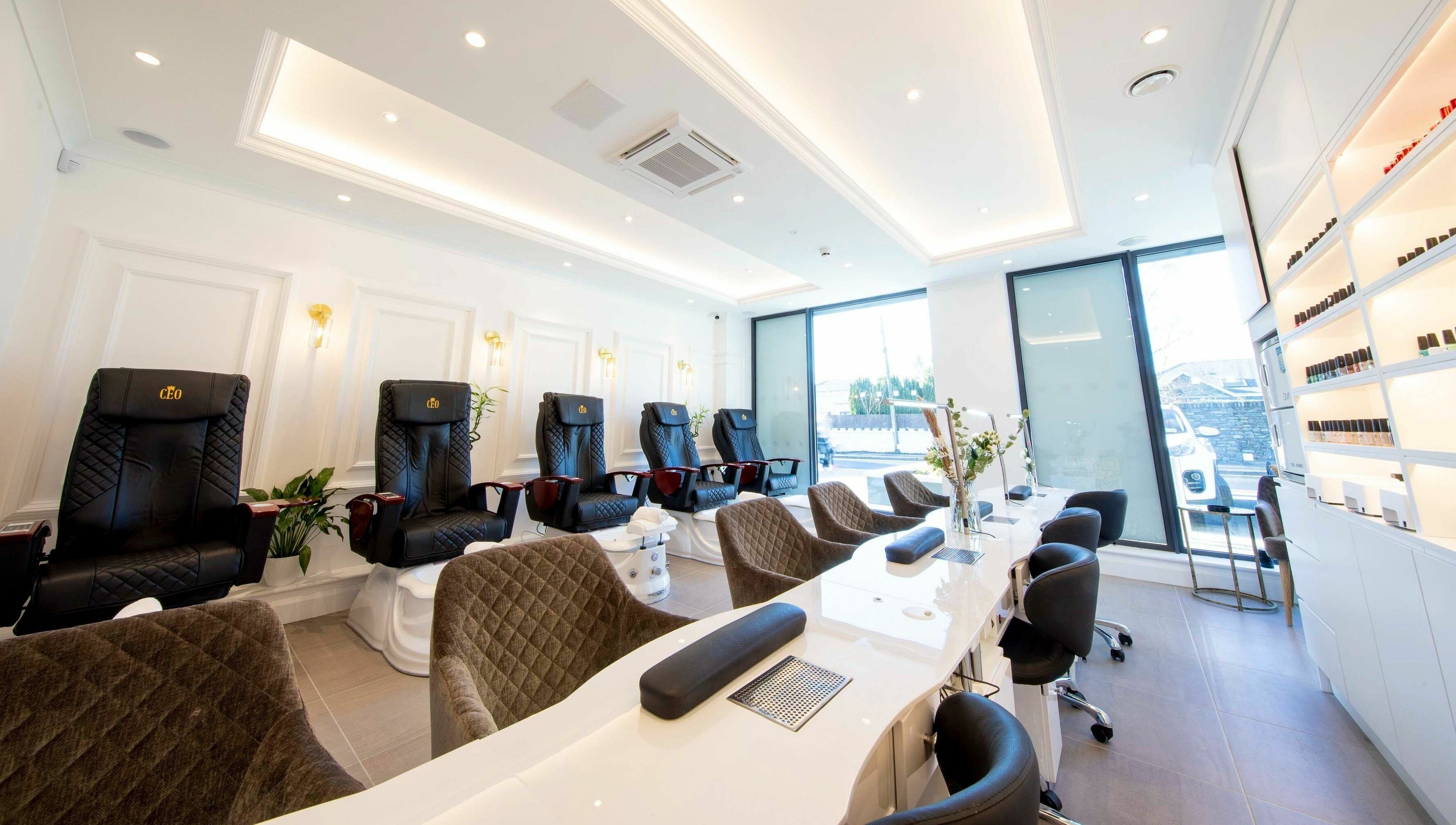 Luxurious salon interior at Charm Clontarf, Dublin, County Dublin, IE with plush seating and chic decor.