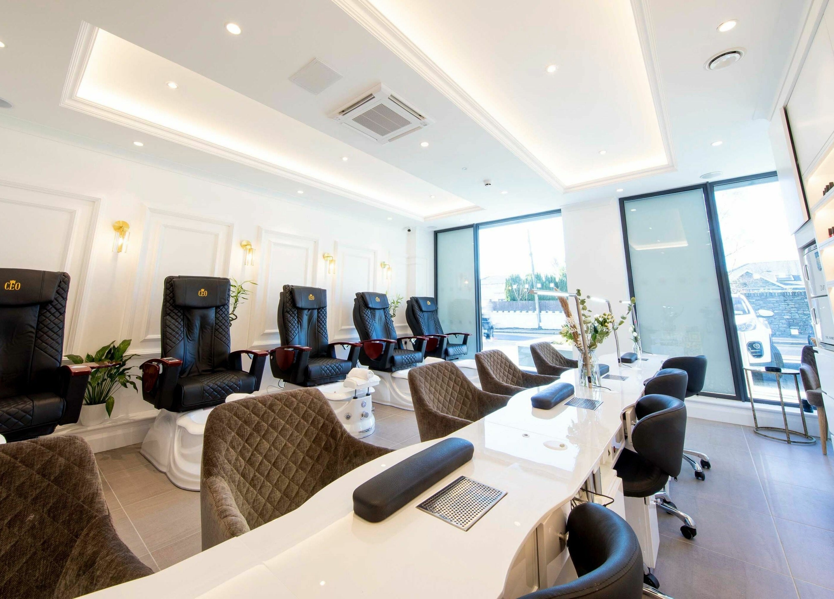 Luxurious salon interior at Charm Clontarf, Dublin, County Dublin, IE with plush seating and chic decor.