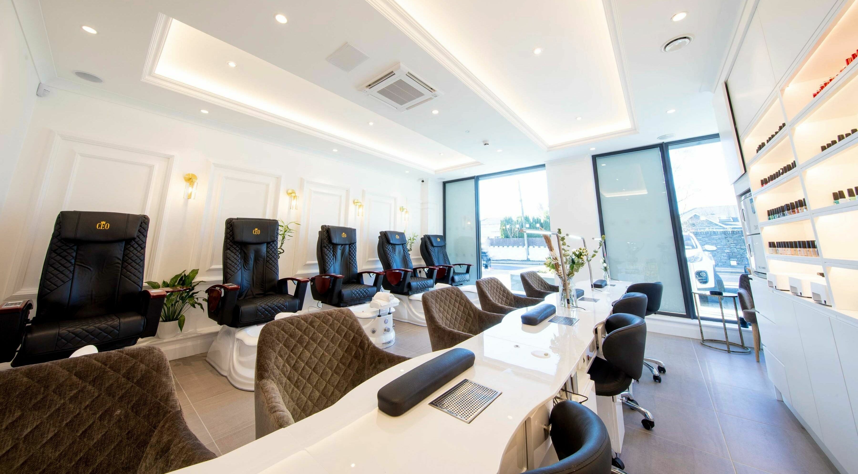 Luxurious salon interior at Charm Clontarf, Dublin, County Dublin, IE with plush seating and chic decor.