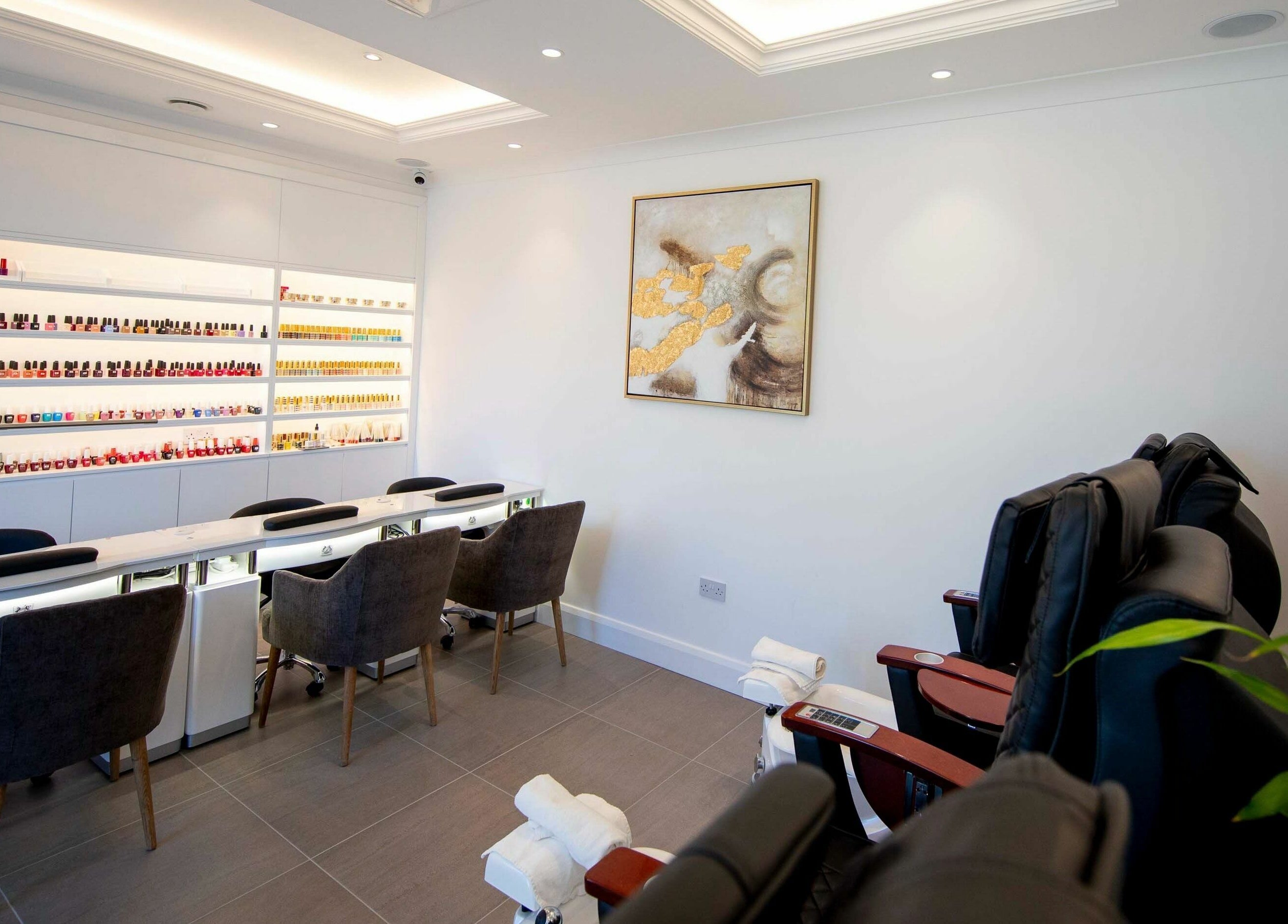 Elegant nail salon interior at Charm Clontarf, Dublin, County Dublin, IE, featuring manicure stations.
