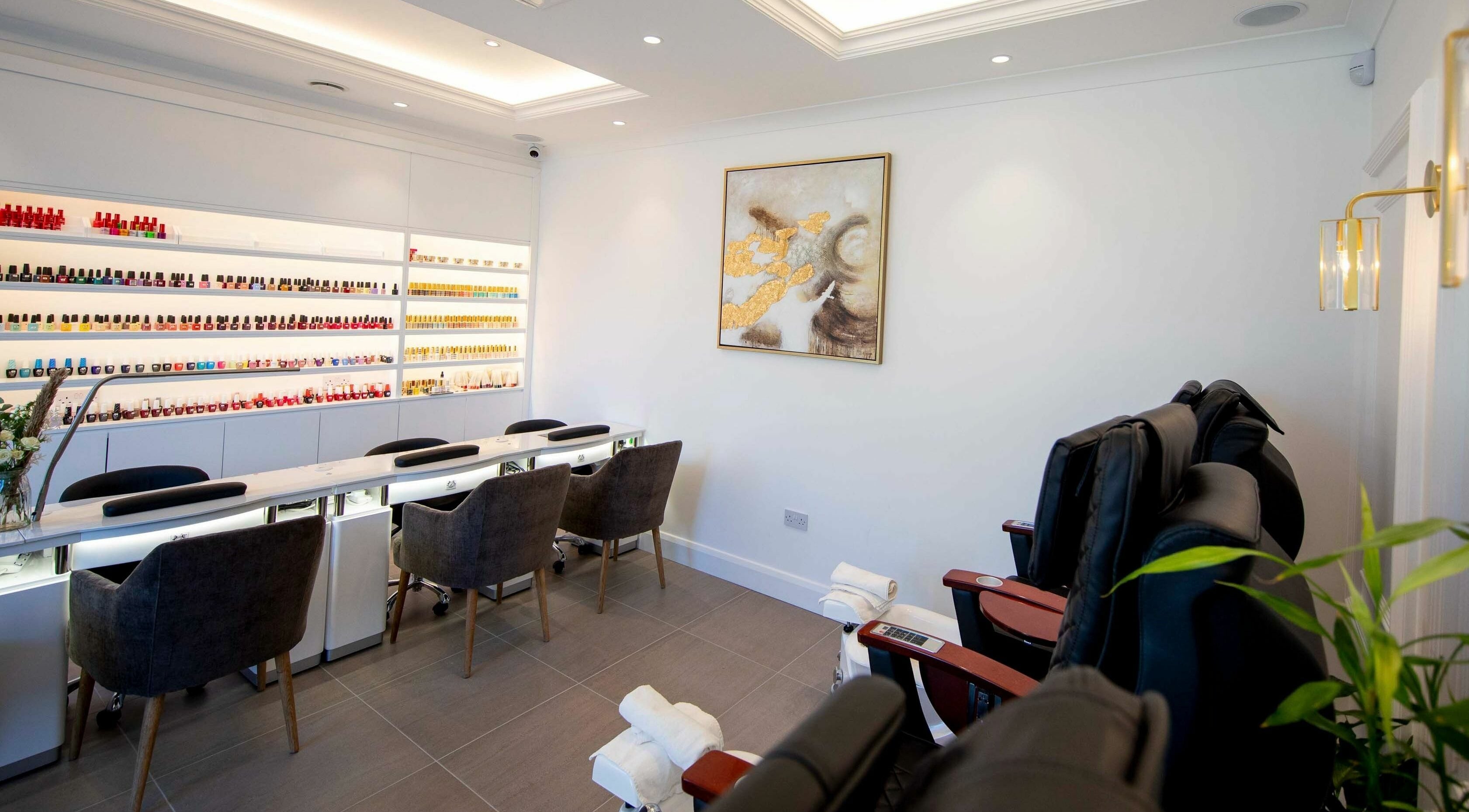 Elegant nail salon interior at Charm Clontarf, Dublin, County Dublin, IE, featuring manicure stations.