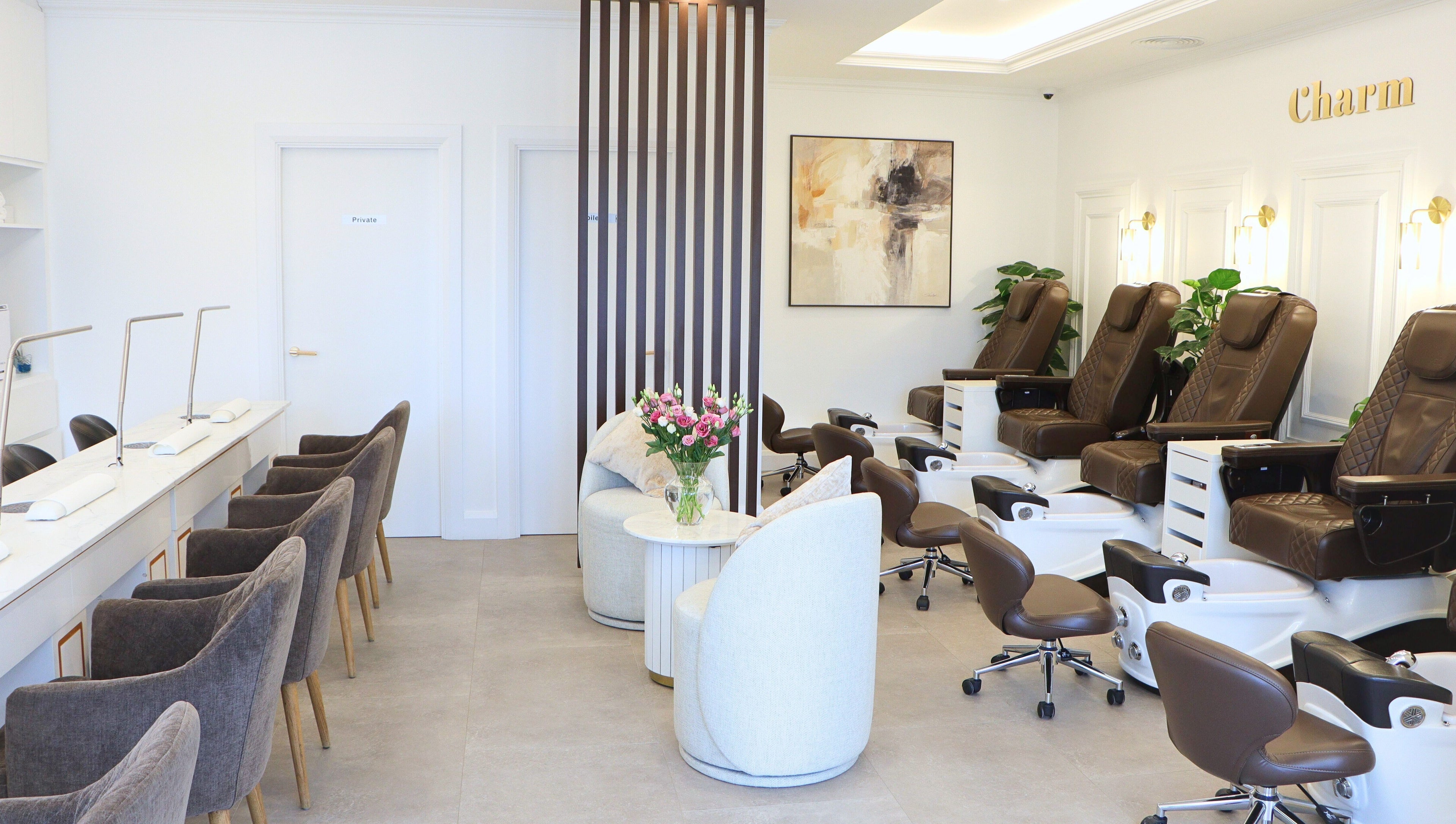 Interior of Charm of Howth in Dublin, County Dublin, IE featuring plush chairs and elegant decor.