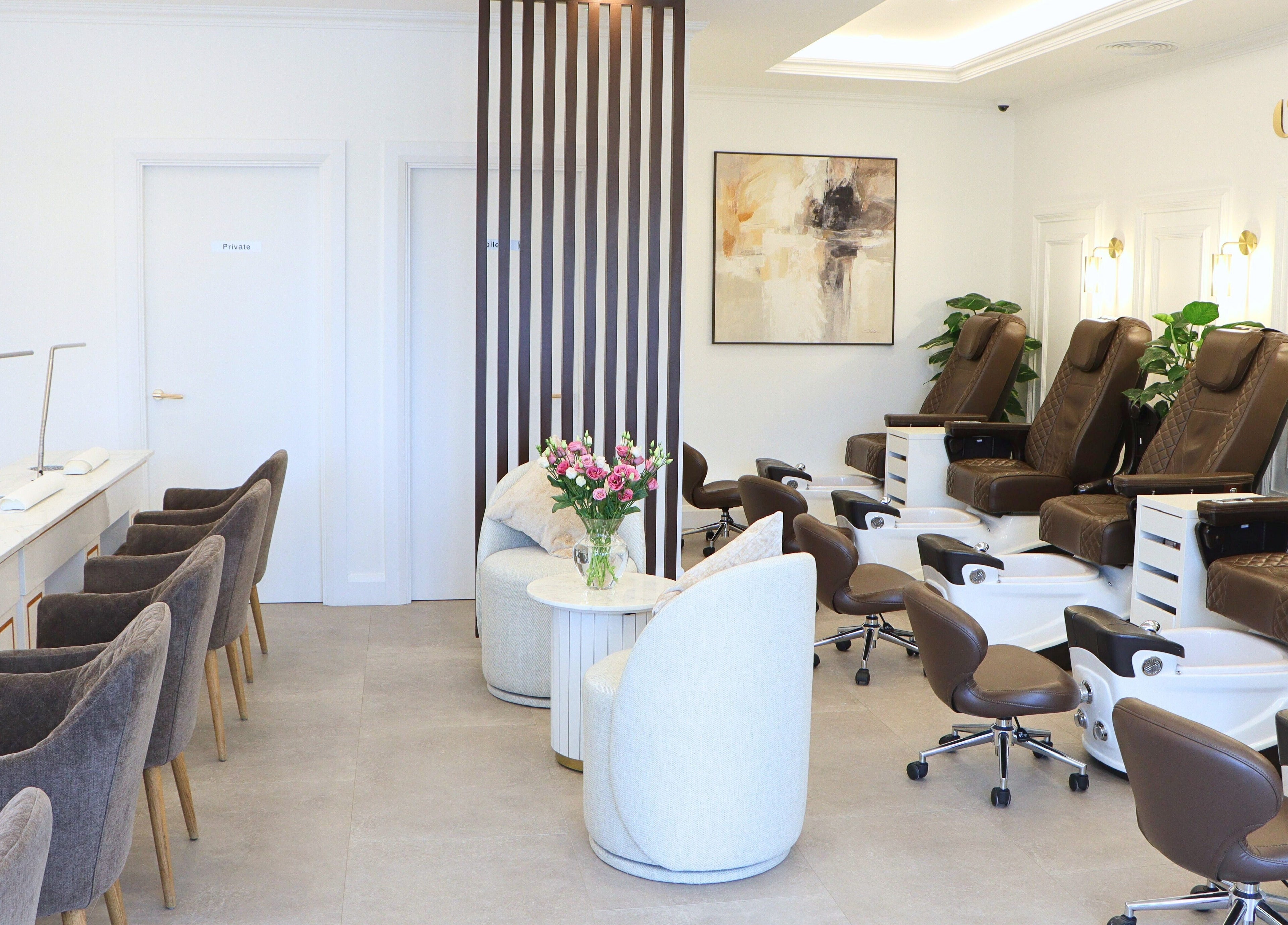 Interior of Charm of Howth in Dublin, County Dublin, IE featuring plush chairs and elegant decor.