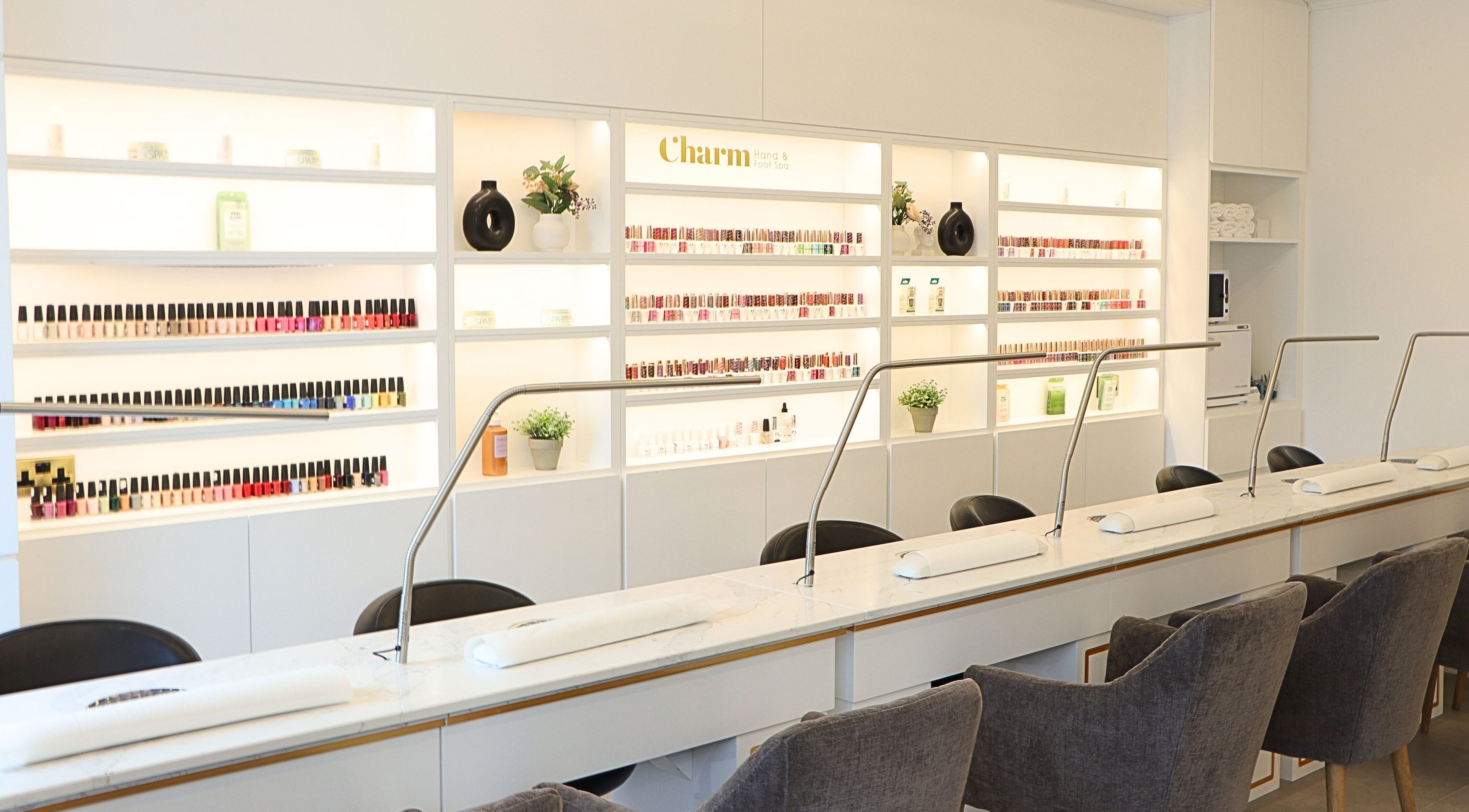 Sleek nail bar at Charm of Howth in Dublin, County Dublin, IE with vibrant nail polish selection.