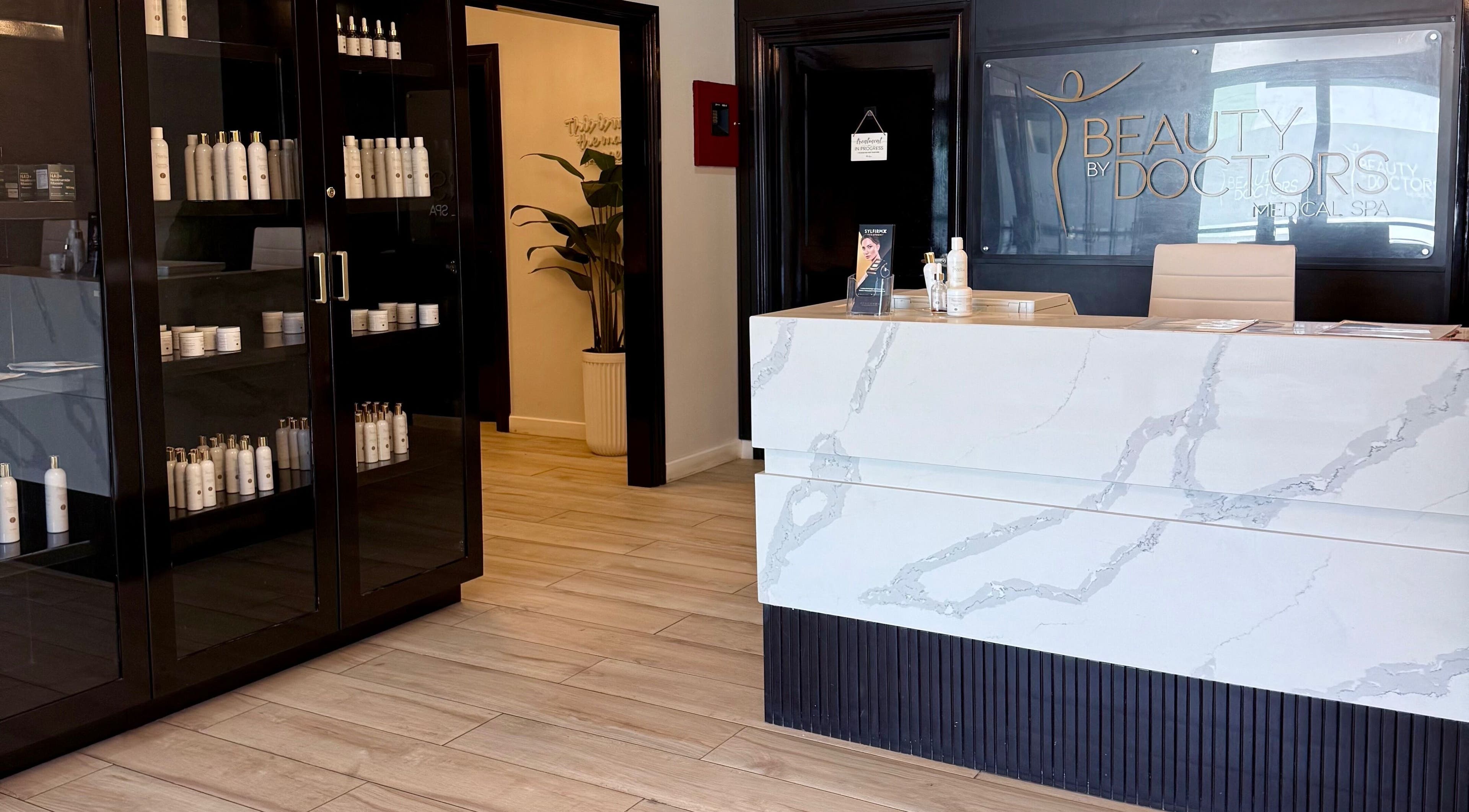 Reception area of Beauty By Doctors Medical Spa in Montego Bay, St. James Parish, JM showcasing product display.
