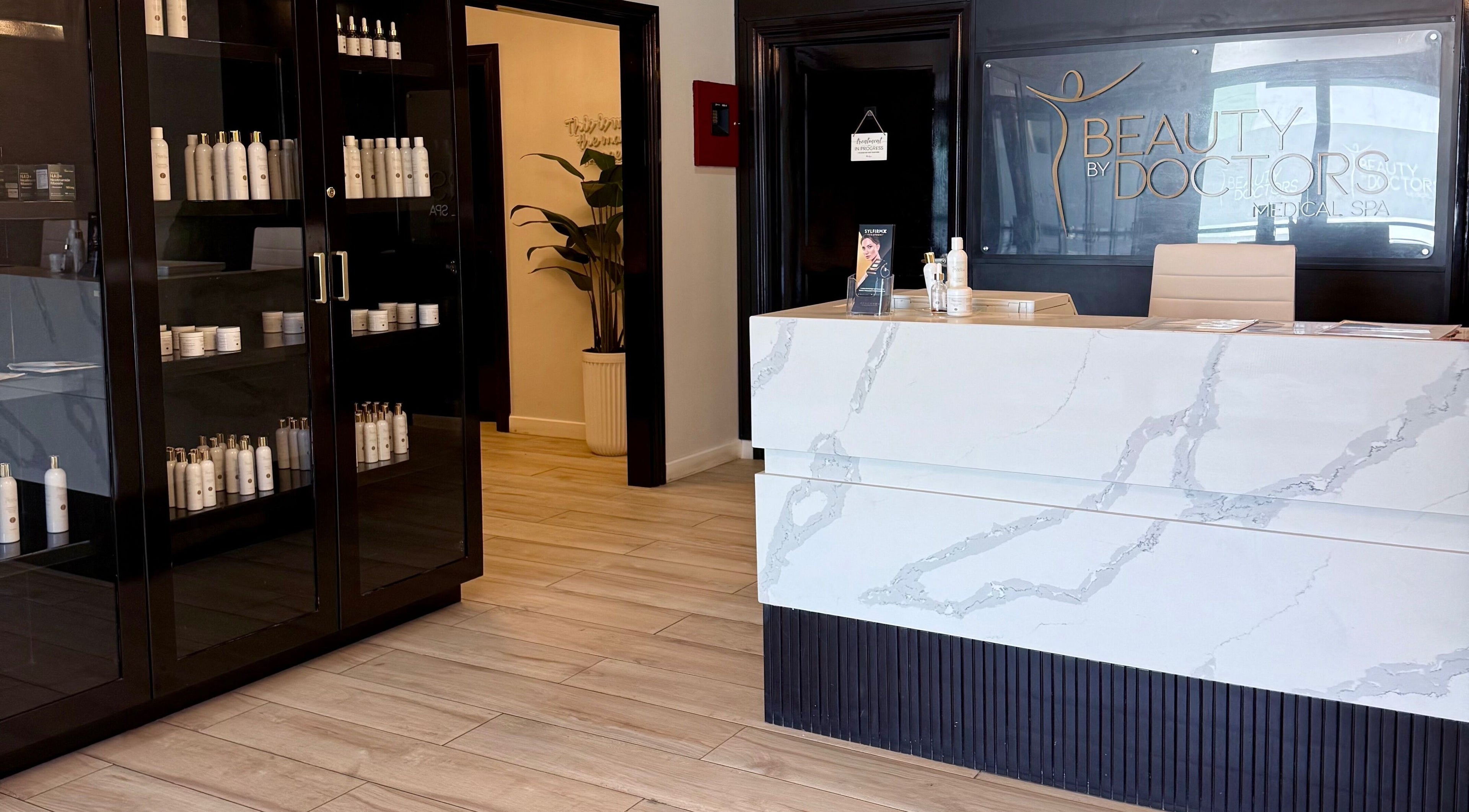 Reception area of Beauty By Doctors Medical Spa in Montego Bay, St. James Parish, JM showcasing product display.