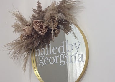Decorative mirror with dried flowers at Nailedbygeorgina, Queensbury, England, GB.