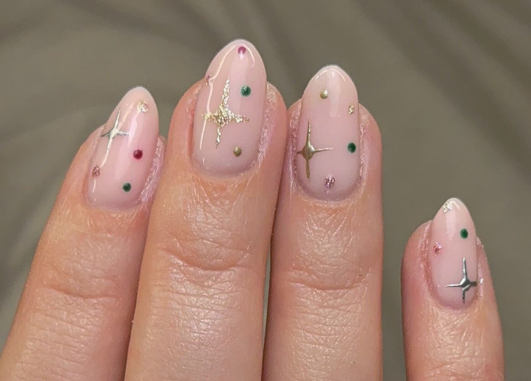 Delicate star-themed manicure by Nailedbygeorgina, Queensbury, England, GB showing elegant nail art.