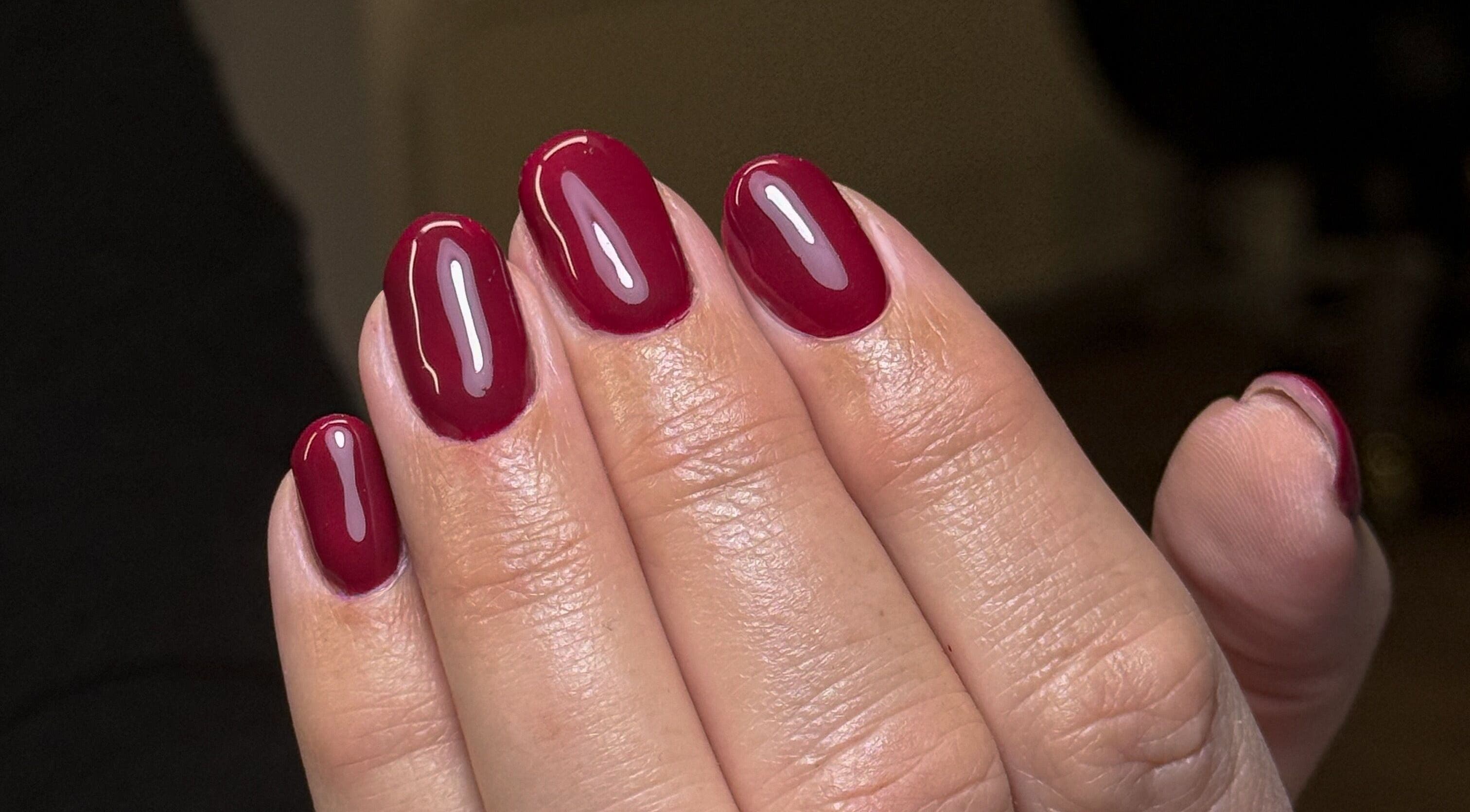 Close-up of elegant red manicure at Nailedbygeorgina, Queensbury, England, GB.