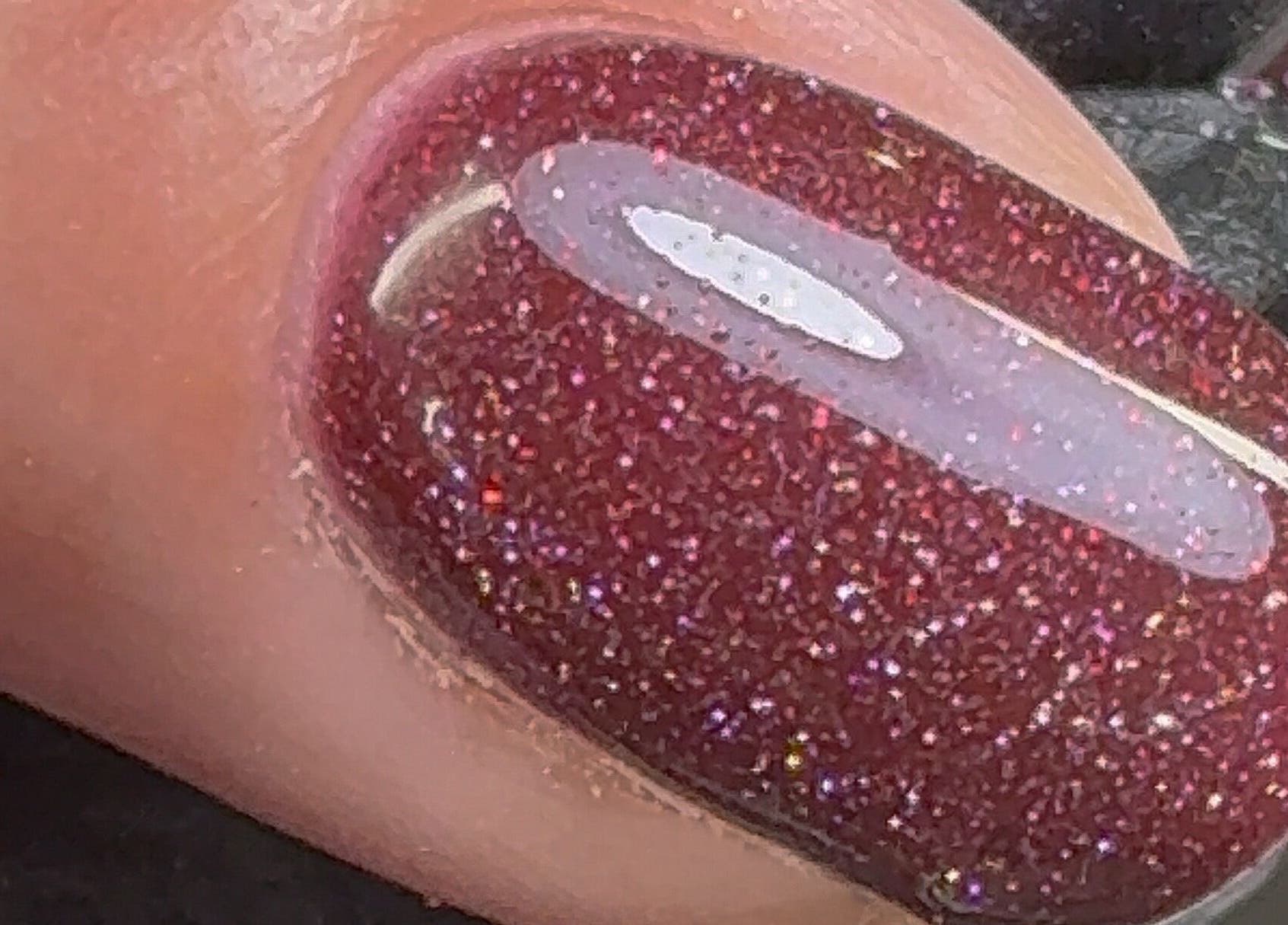 Close-up of glittery red nail art from Nailedbygeorgina, Queensbury, England, GB.