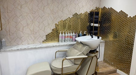 Luxurious hair washing station at Beauty With Raye in Bristol, England, GB, featuring gold and marble design.