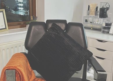 Cozy salon chair and vanity setup at RT Beauty, Lisburn, Northern Ireland, GB, showcasing luxury and comfort.