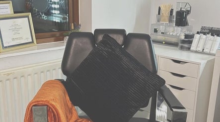 Cozy salon chair and vanity setup at RT Beauty, Lisburn, Northern Ireland, GB, showcasing luxury and comfort.