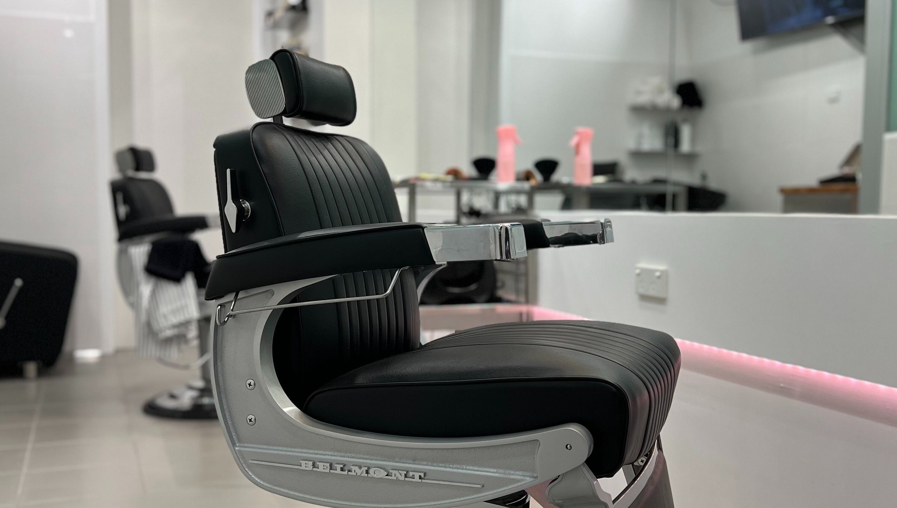 Modern barber chair at Freshwater Barbers in Southbank, Victoria, AU, highlighting sleek design and comfort.