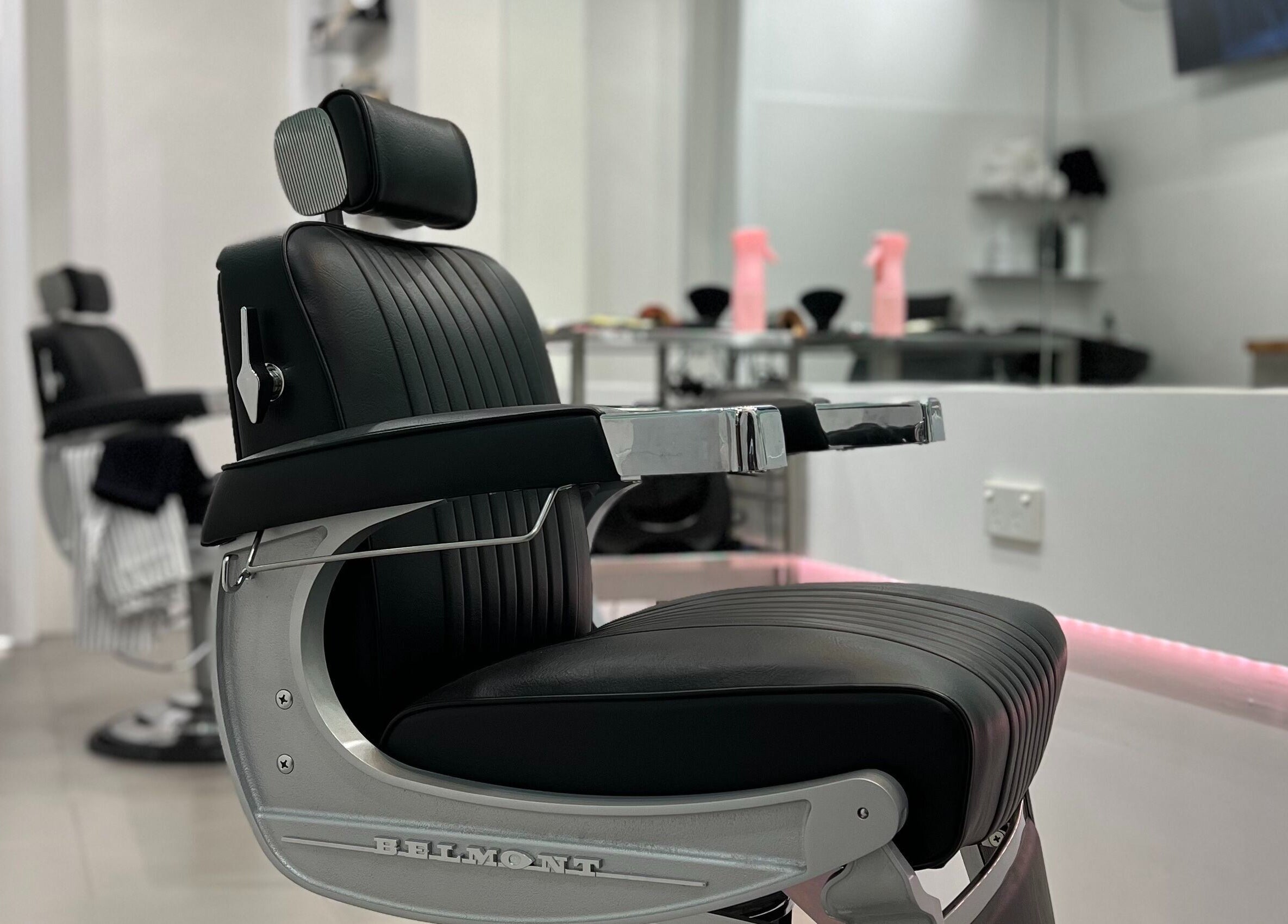Modern barber chair at Freshwater Barbers in Southbank, Victoria, AU, highlighting sleek design and comfort.