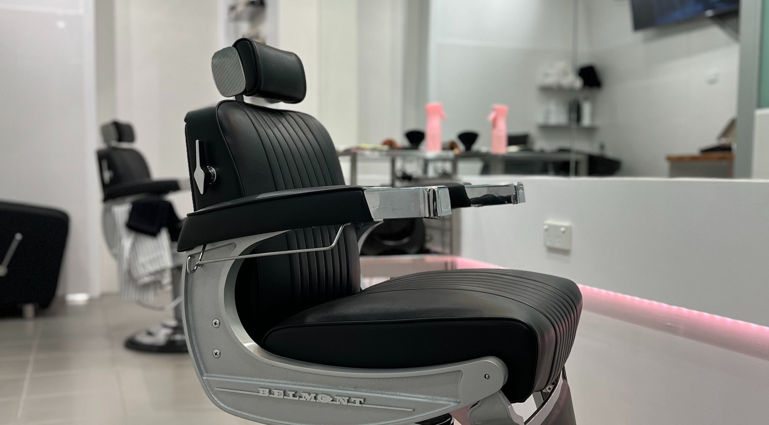 Modern barber chair at Freshwater Barbers in Southbank, Victoria, AU, highlighting sleek design and comfort.