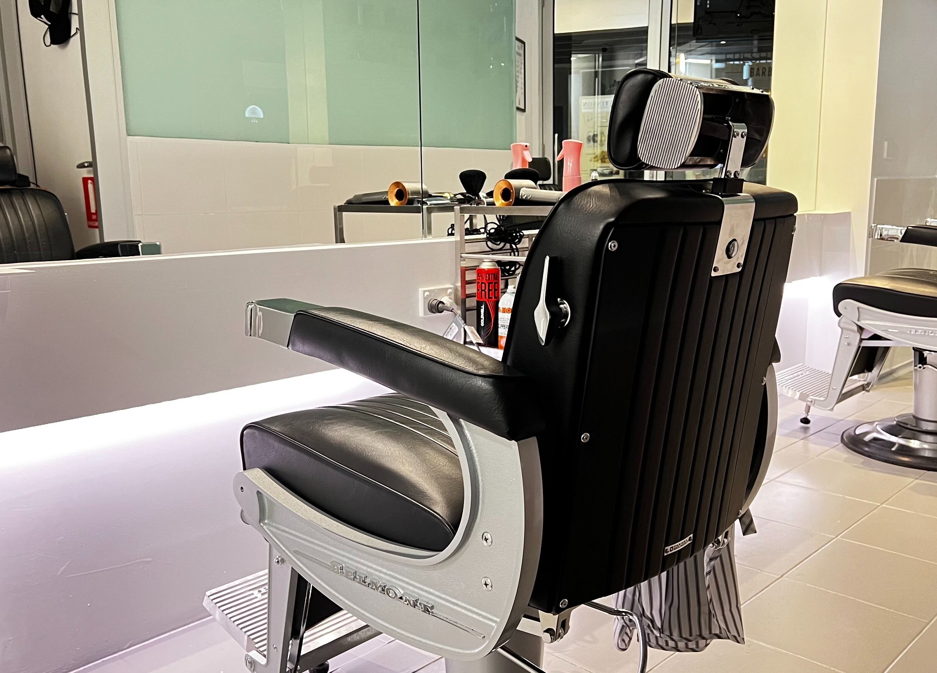 Modern barber chair at Freshwater Barbers, Southbank, Victoria, AU, showcasing sleek style and comfort.