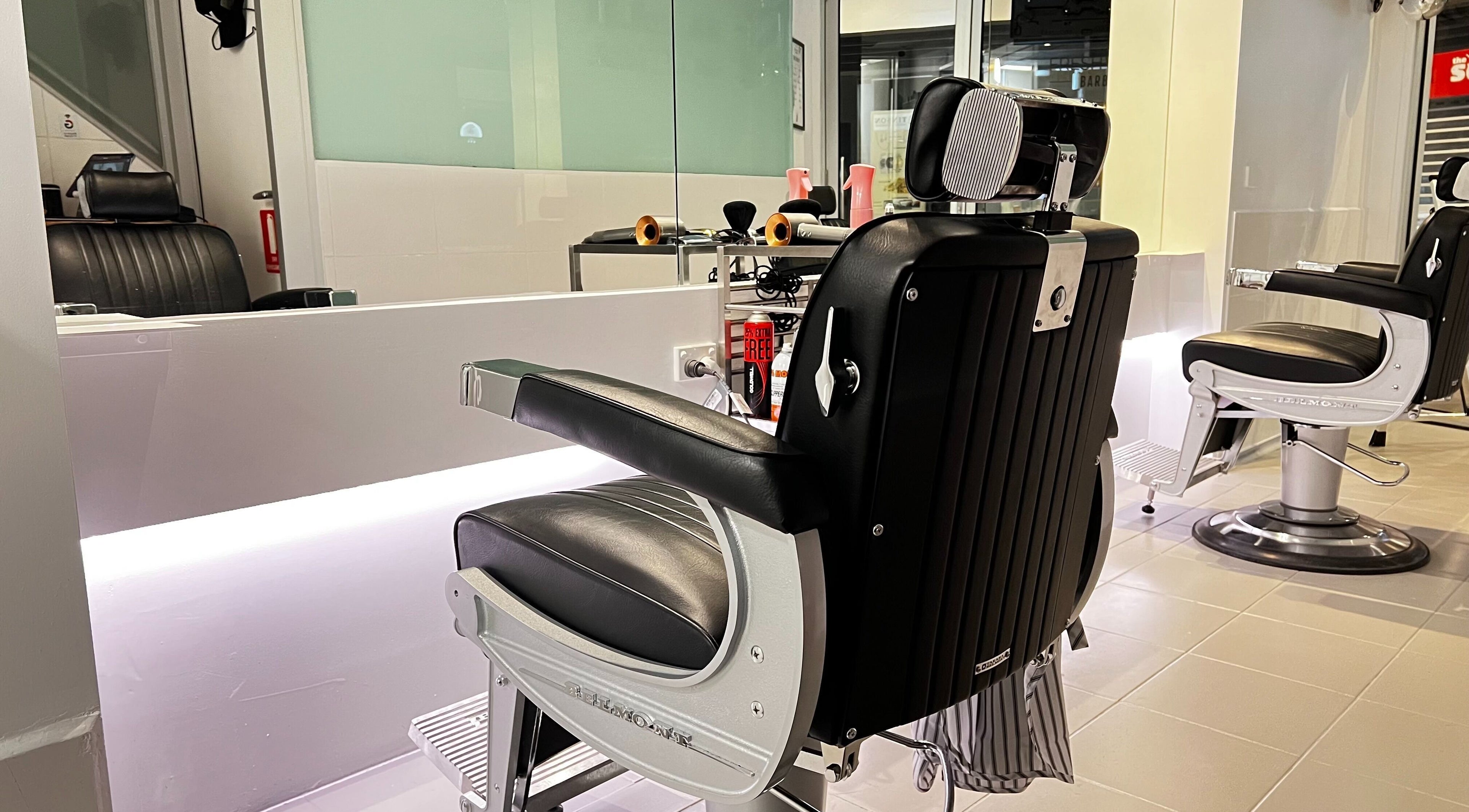Modern barber chair at Freshwater Barbers, Southbank, Victoria, AU, showcasing sleek style and comfort.