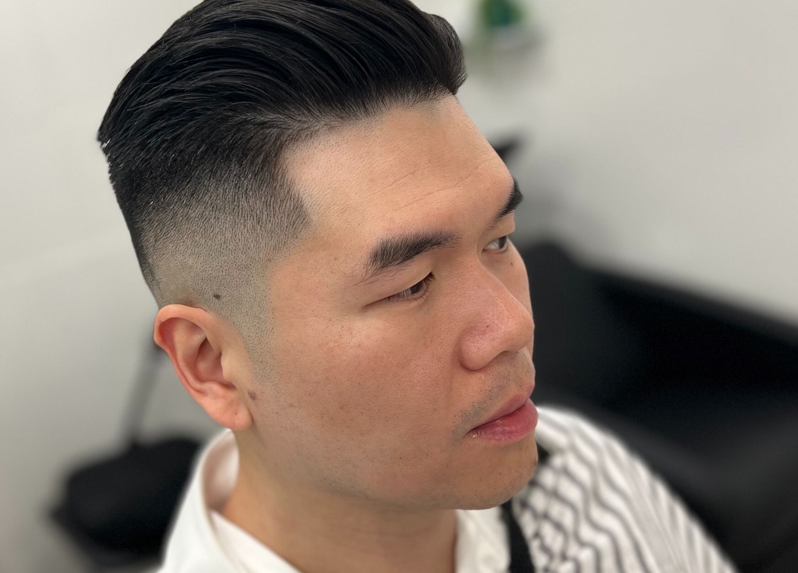 Close-up of a stylish haircut at Freshwater Barbers in Southbank, Victoria, AU.