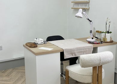Nail salon station at Mika Beauty, Wilmslow, England, GB, showcasing a cozy and modern treatment area.