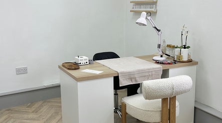 Nail salon station at Mika Beauty, Wilmslow, England, GB, showcasing a cozy and modern treatment area.