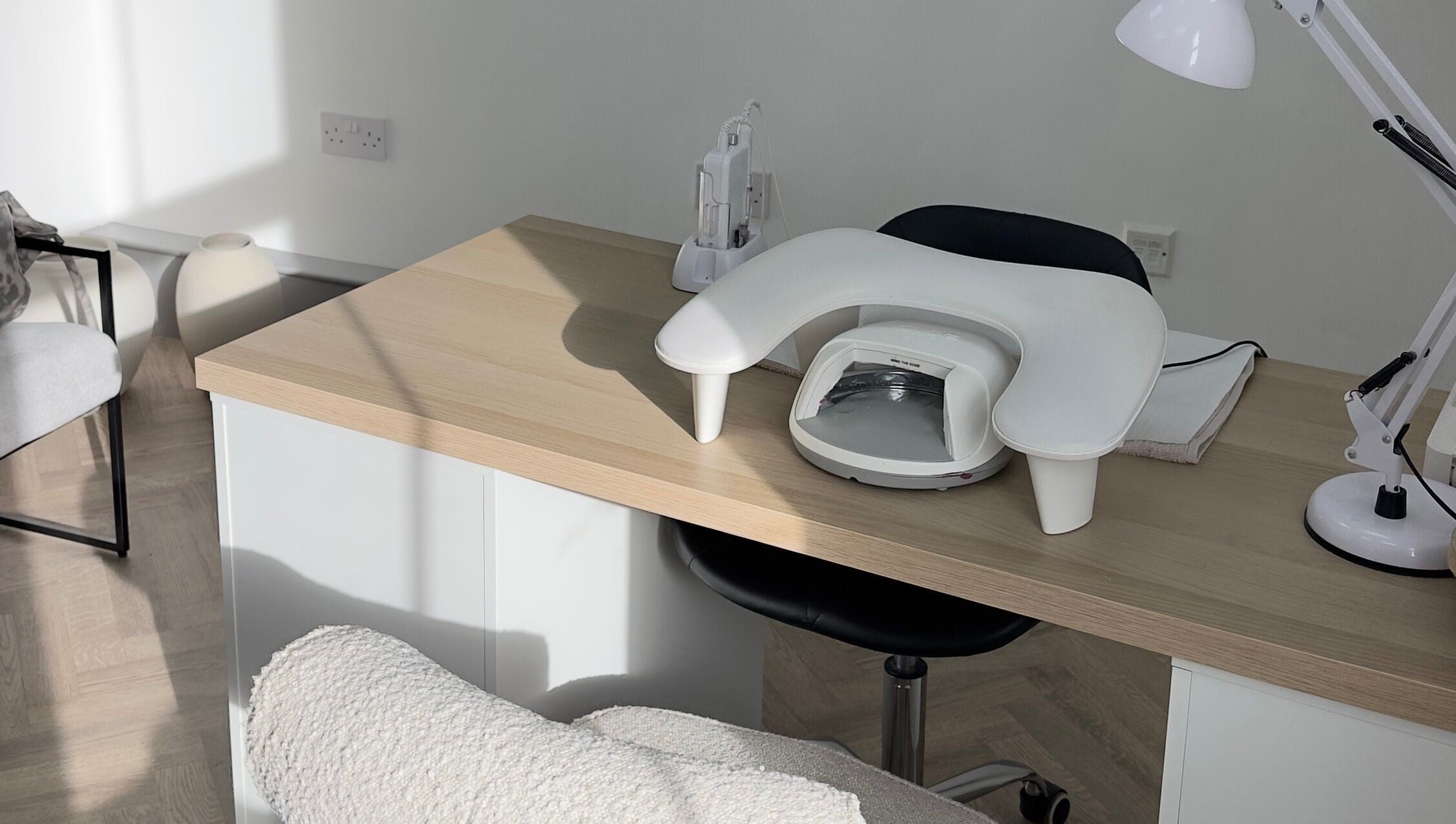 Nail station at Mika Beauty in Wilmslow, England, GB, featuring sleek design and comfortable seating.