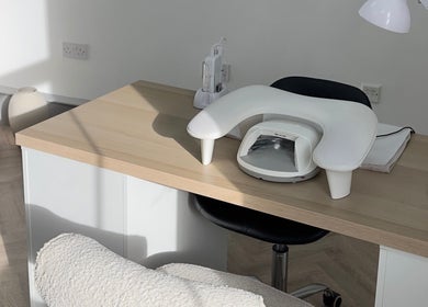 Nail station at Mika Beauty in Wilmslow, England, GB, featuring sleek design and comfortable seating.