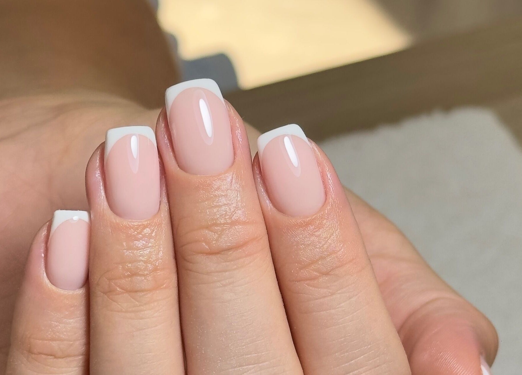 French manicure by Mika Beauty in Wilmslow, England, GB. Clean, elegant nail design with glossy finish.