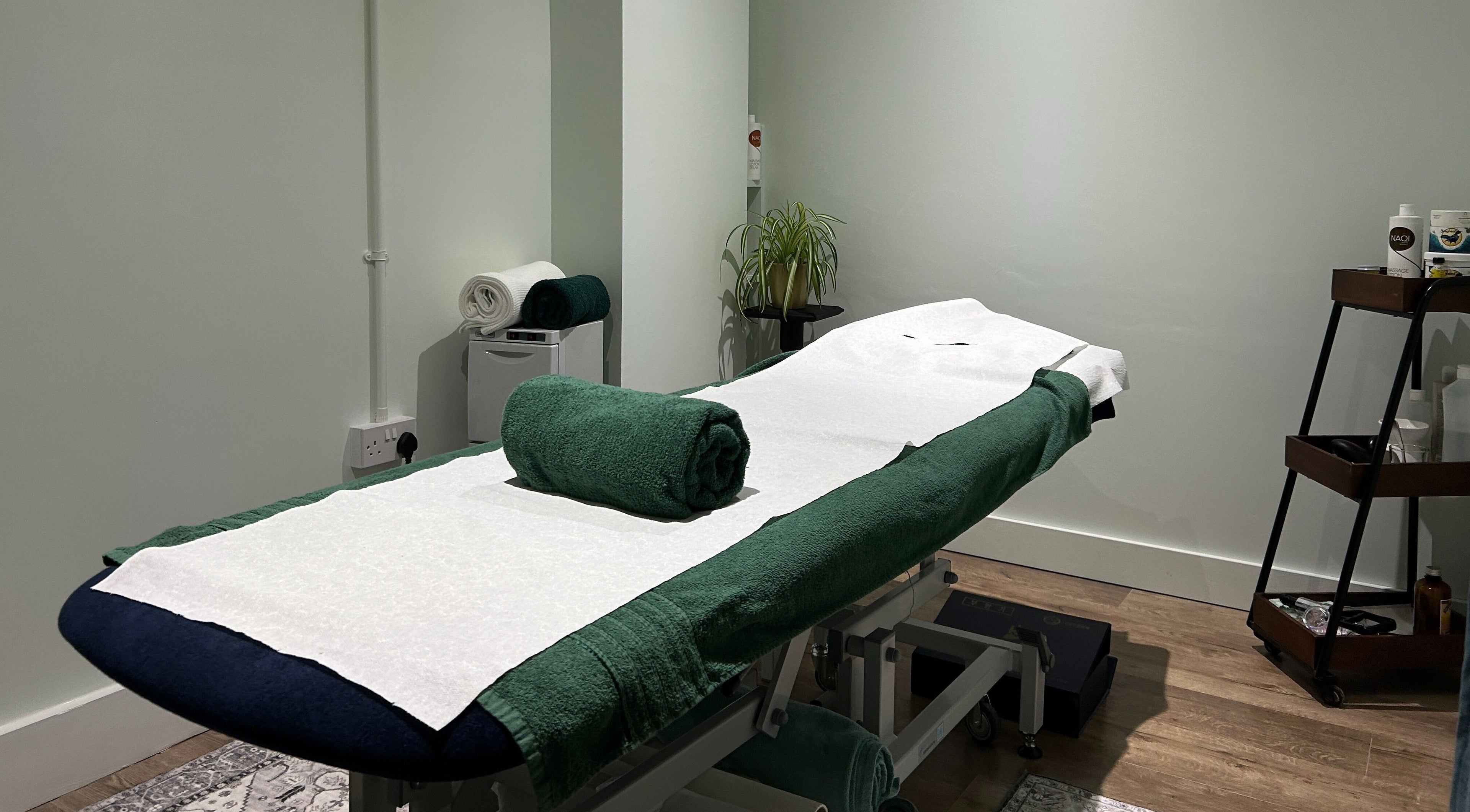 Serene treatment room at Aramagen Holistic Clinic, Chester, England, GB with massage table ready.
