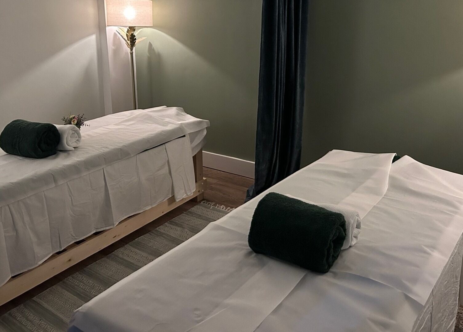 Relaxing massage room at Aramagen Holistic Clinic, Chester, England, GB. Cozy ambiance with two massage tables.