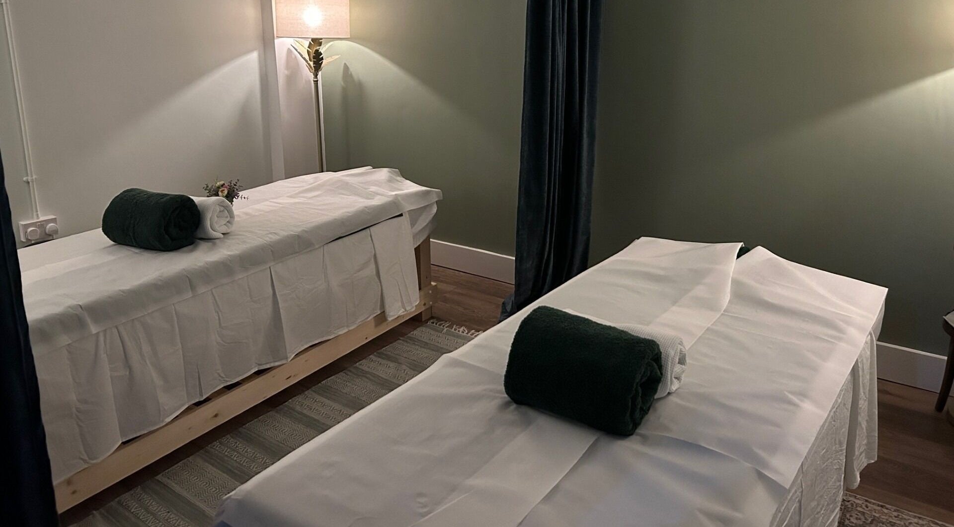 Relaxing massage room at Aramagen Holistic Clinic, Chester, England, GB. Cozy ambiance with two massage tables.