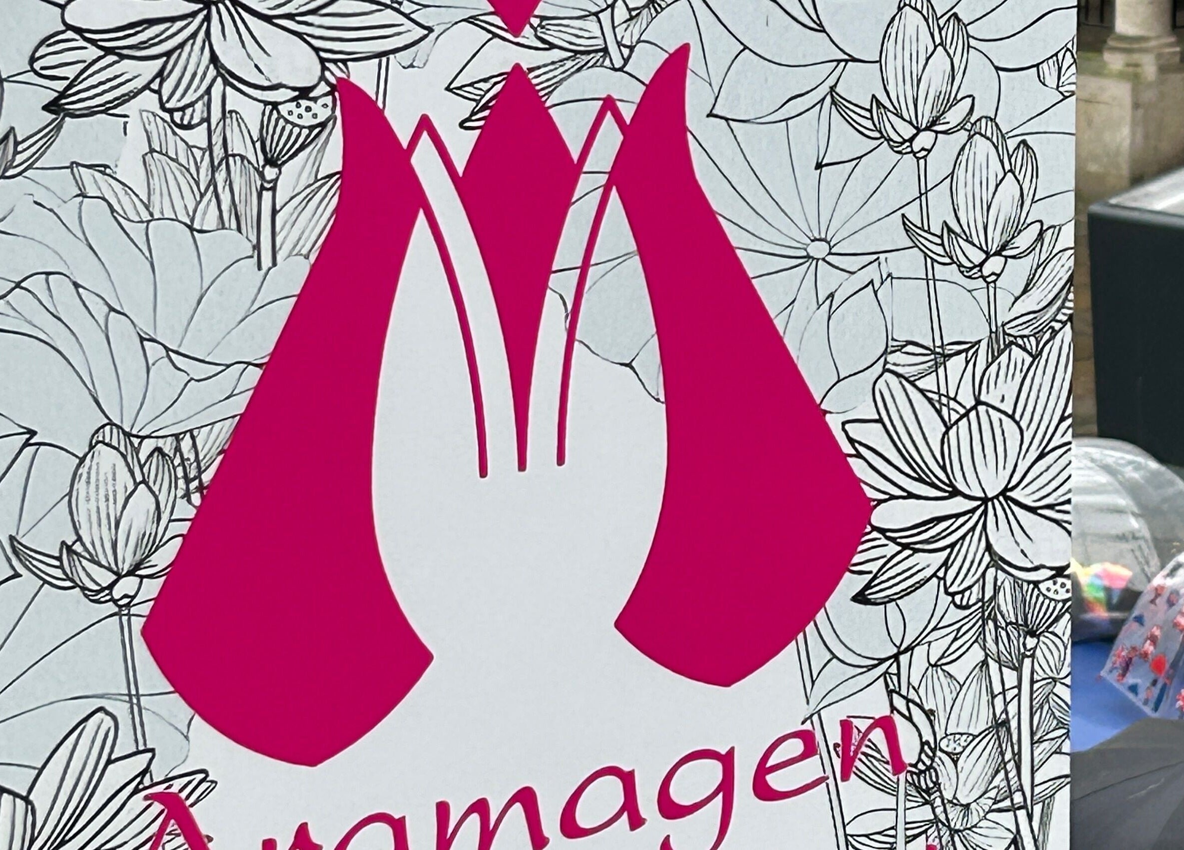 Aramagen Holistic Clinic sign with floral design in Chester, England, GB.