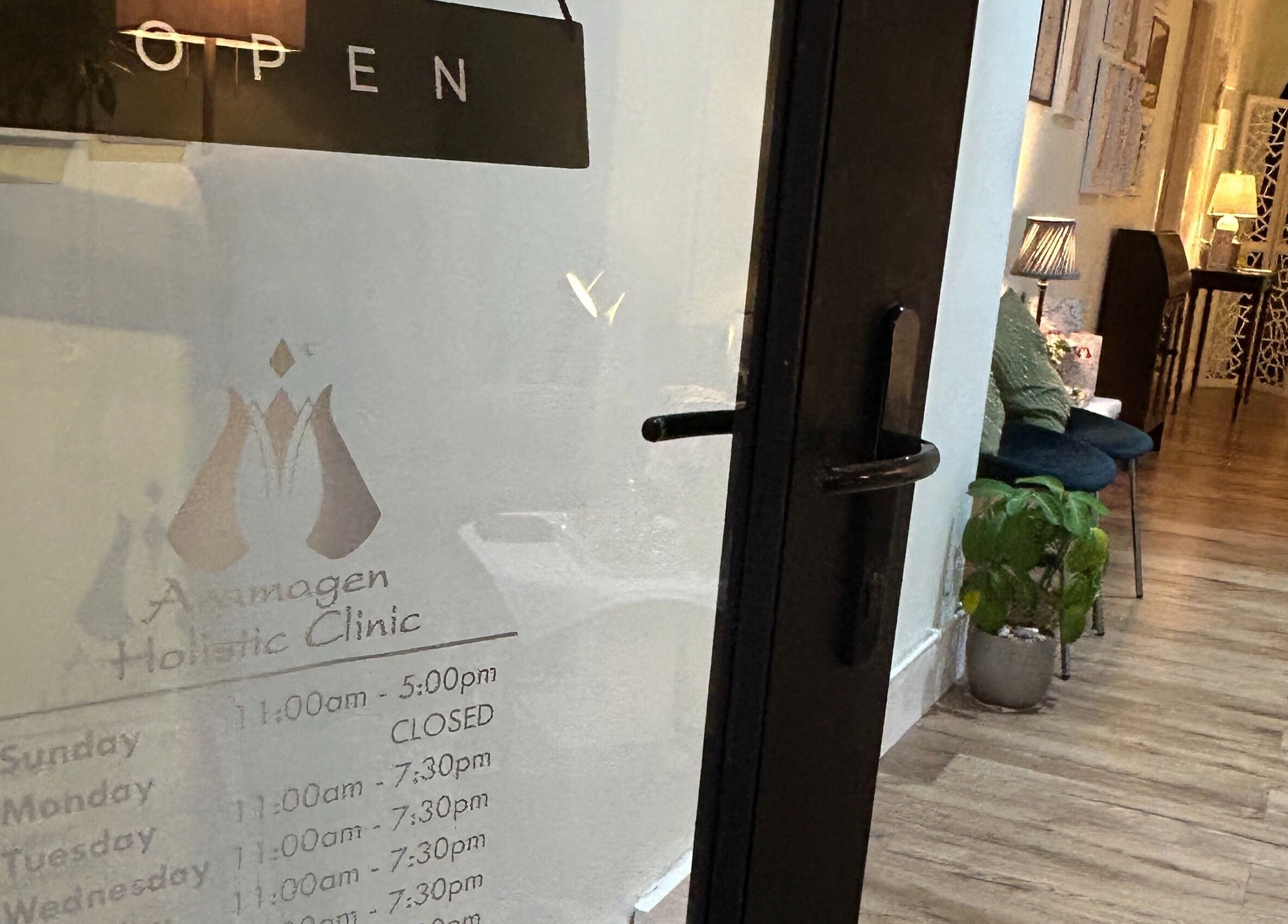 Entrance to Aramagen Holistic Clinic showing open sign and inviting interior in Chester, England, GB.