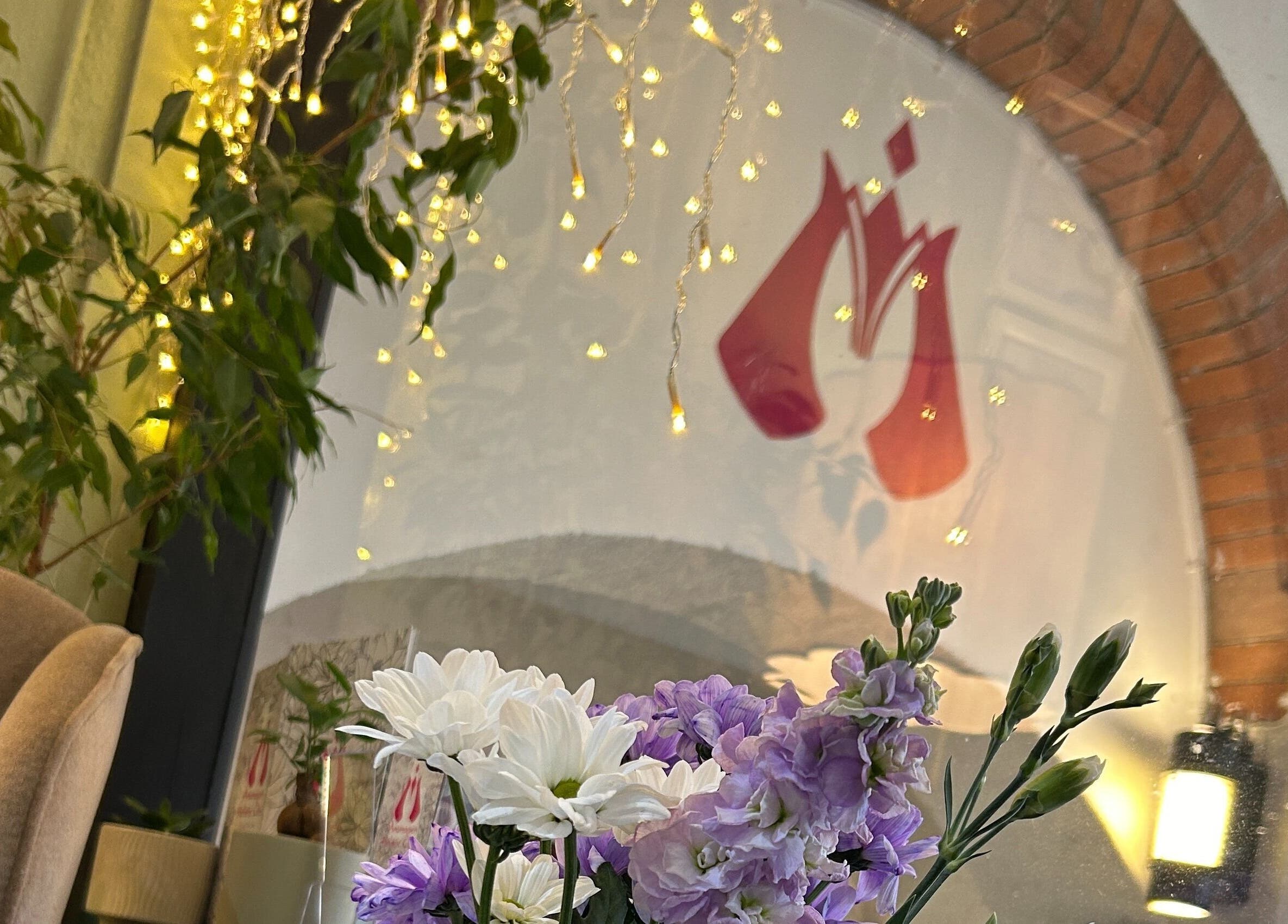 Vibrant flowers and soft lighting at Aramagen Holistic Clinic, Chester, England, GB, creating a peaceful ambiance.