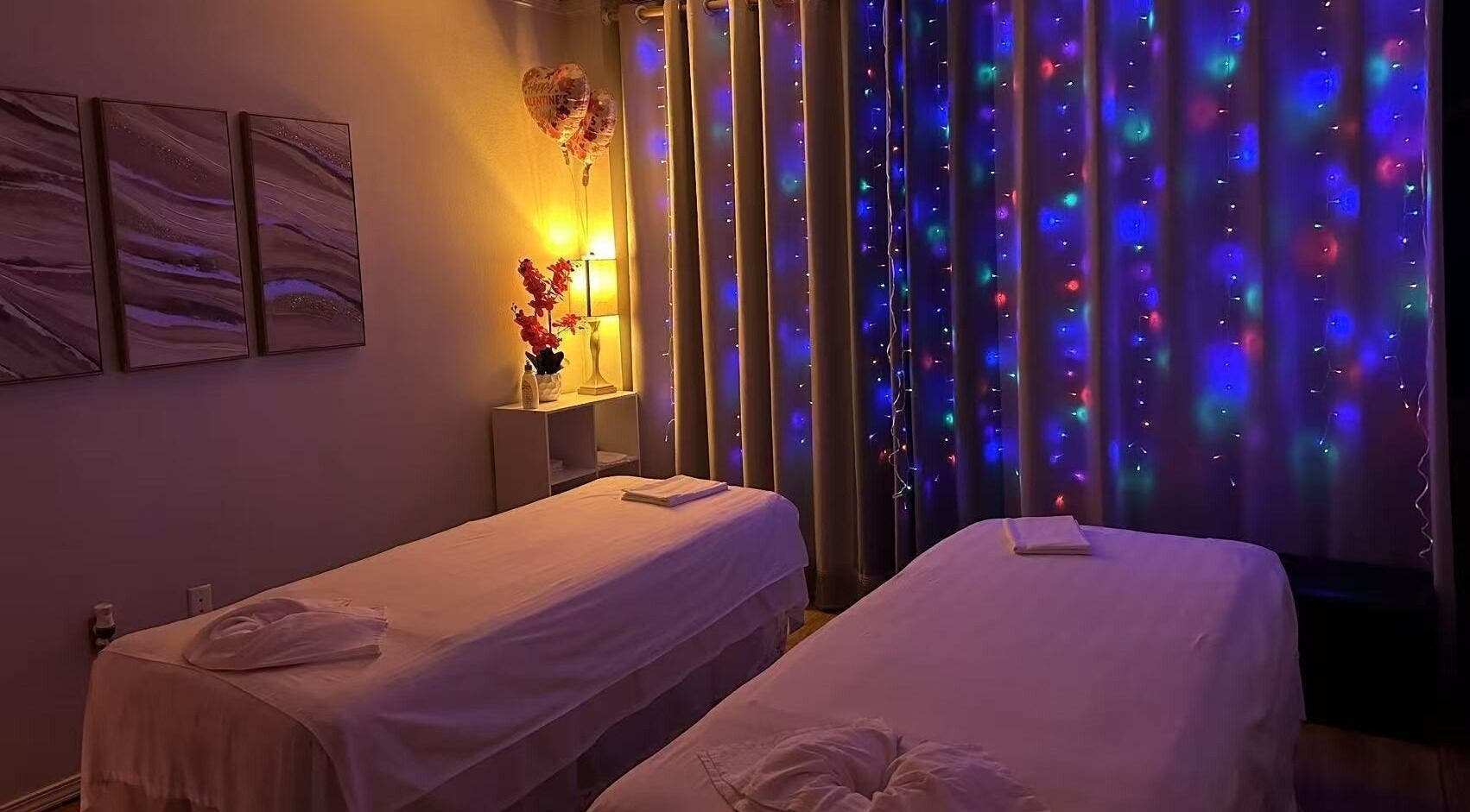 Relaxing massage room with ambient lighting at Massage Relax & Spa, Springdale, Arkansas, US.