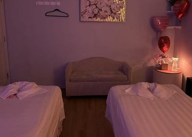 Cozy massage room with twin beds at Massage Relax & Spa, Springdale, Arkansas, US, creating a soothing ambiance.