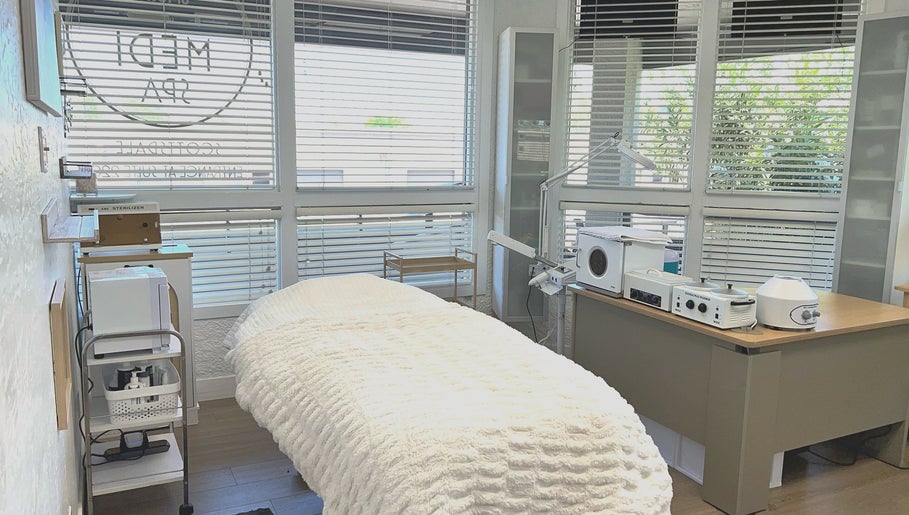 Relaxing treatment room at Bare Lacquer Scottsdale in Scottsdale, Arizona, US, bathed in natural light.