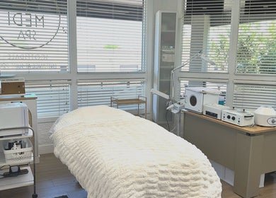 Relaxing treatment room at Bare Lacquer Scottsdale in Scottsdale, Arizona, US, bathed in natural light.