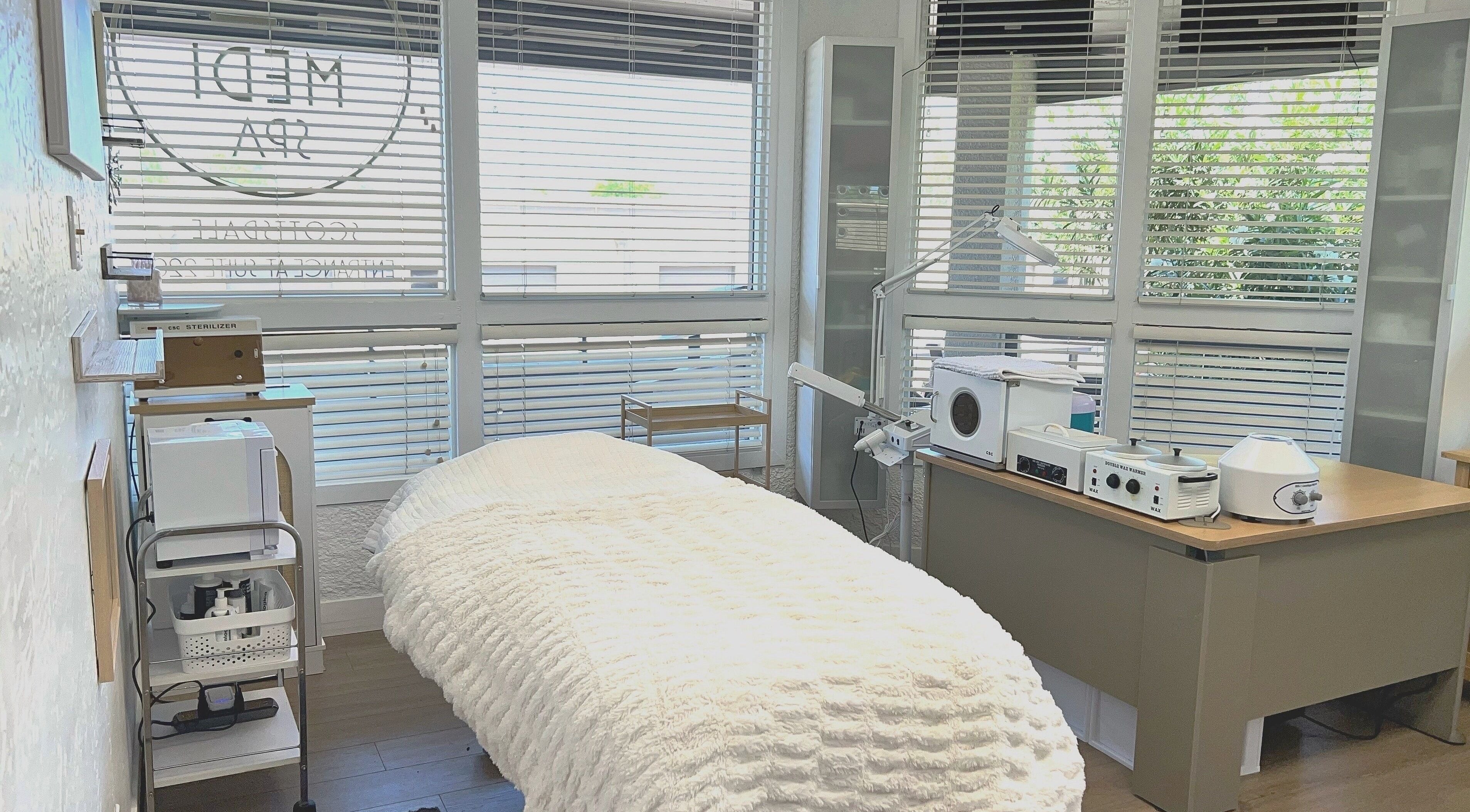 Relaxing treatment room at Bare Lacquer Scottsdale in Scottsdale, Arizona, US, bathed in natural light.