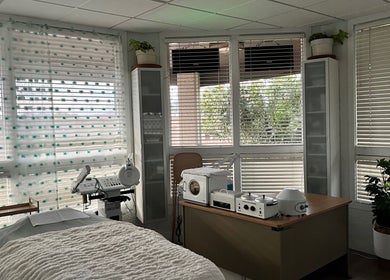 Calming treatment room at Bare Lacquer Scottsdale, Scottsdale, Arizona, US with soft lighting and cozy bed.