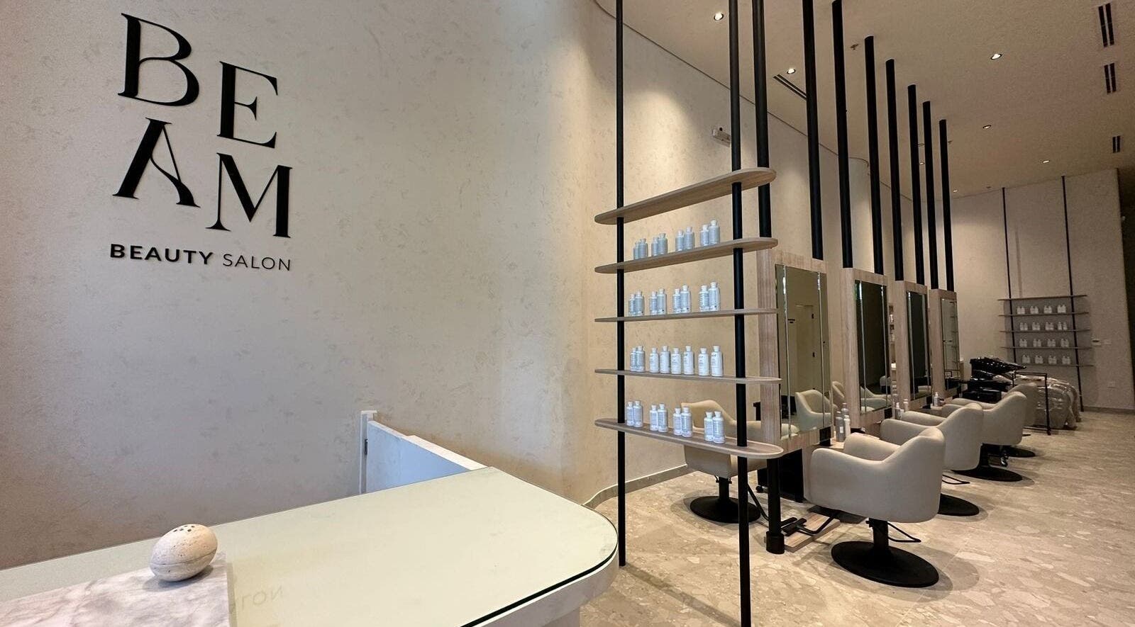 Elegant Beam Beauty Salon interior in جدة, Makkah Province, SA featuring sleek design and seating.